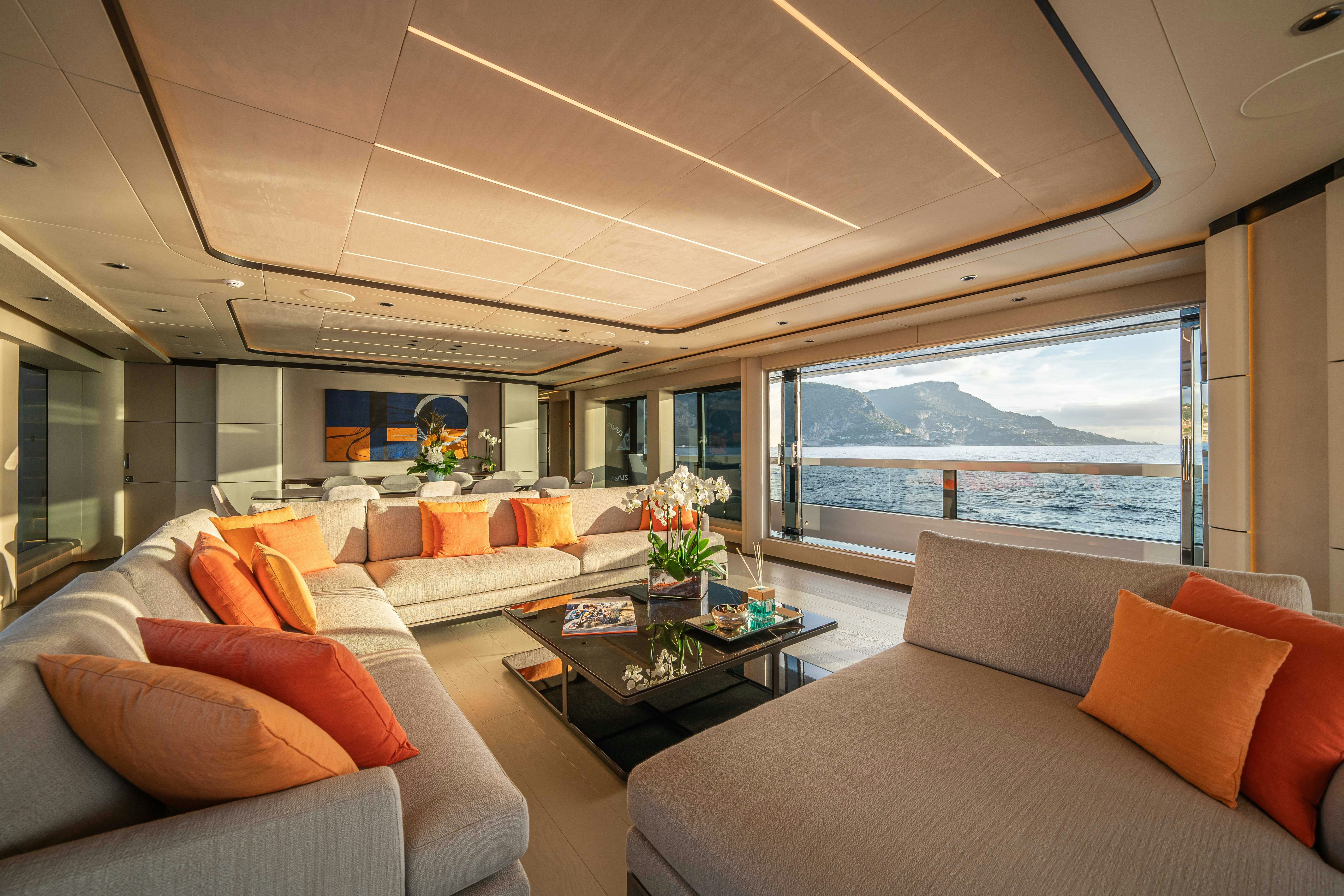 a living room with couches and a table aboard OCEAN KING DUCALE 120 Yacht for Sale