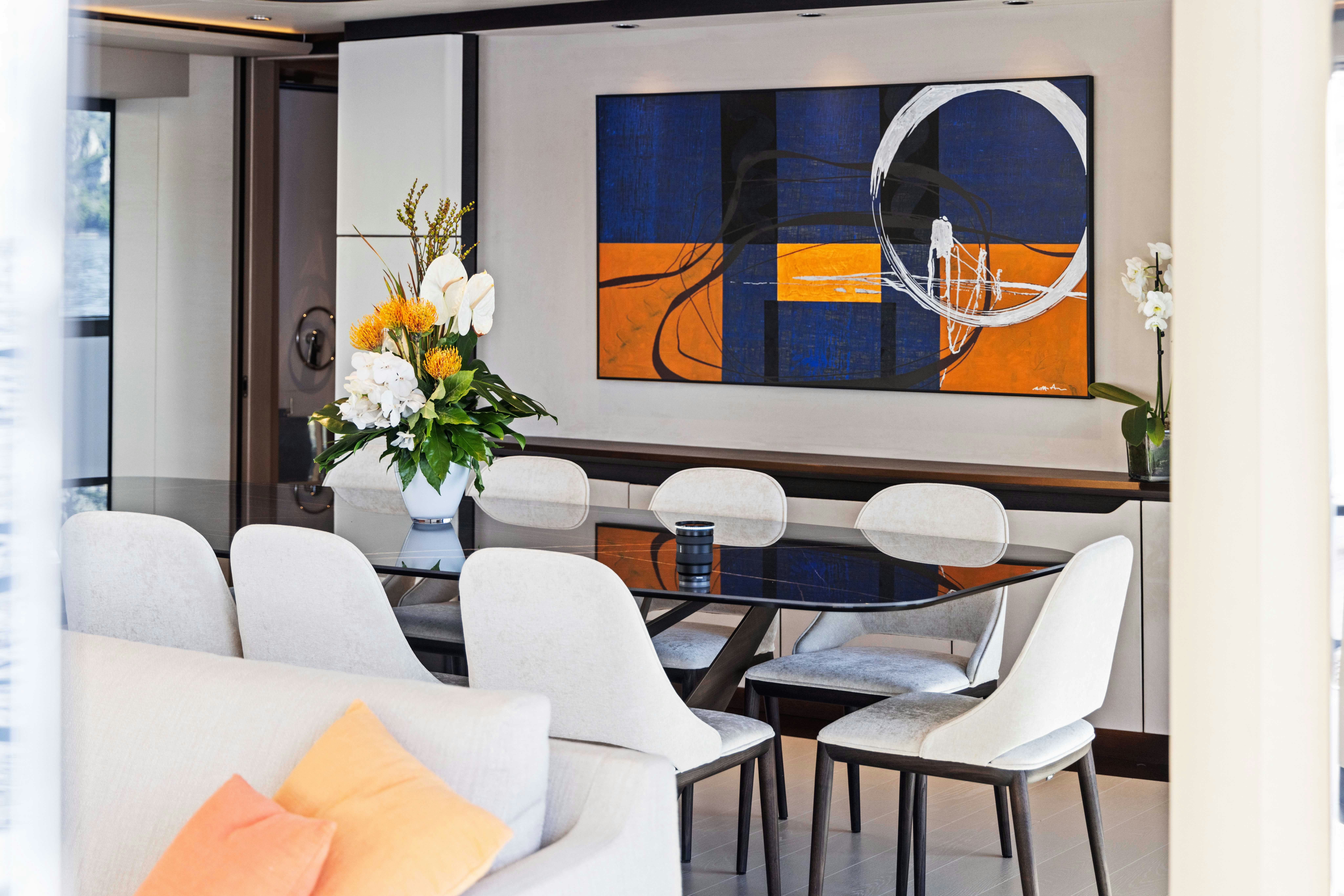 a room with chairs and a table aboard OCEAN KING DUCALE 120 Yacht for Sale