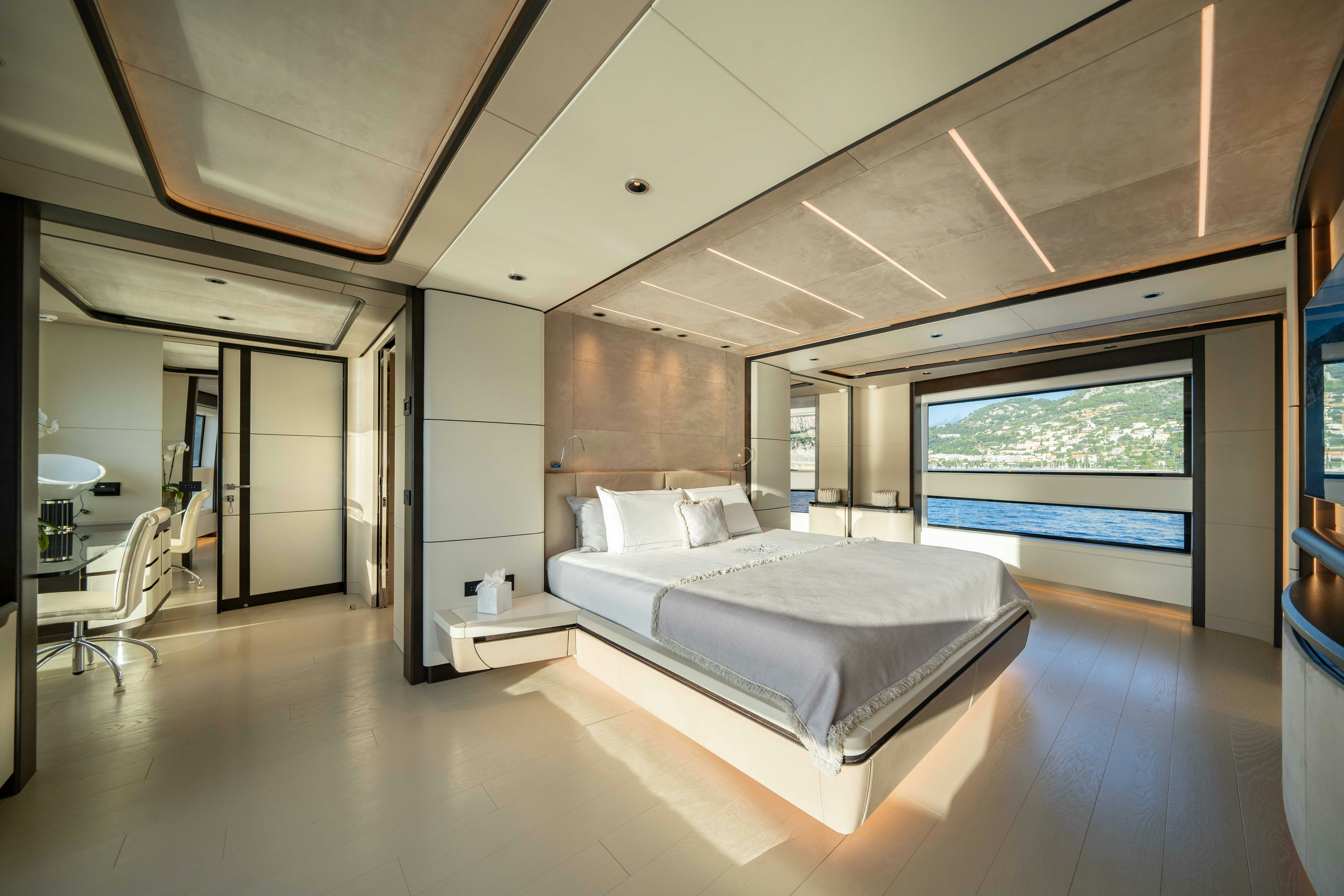 a large bedroom with a large bed aboard OCEAN KING DUCALE 120 Yacht for Sale