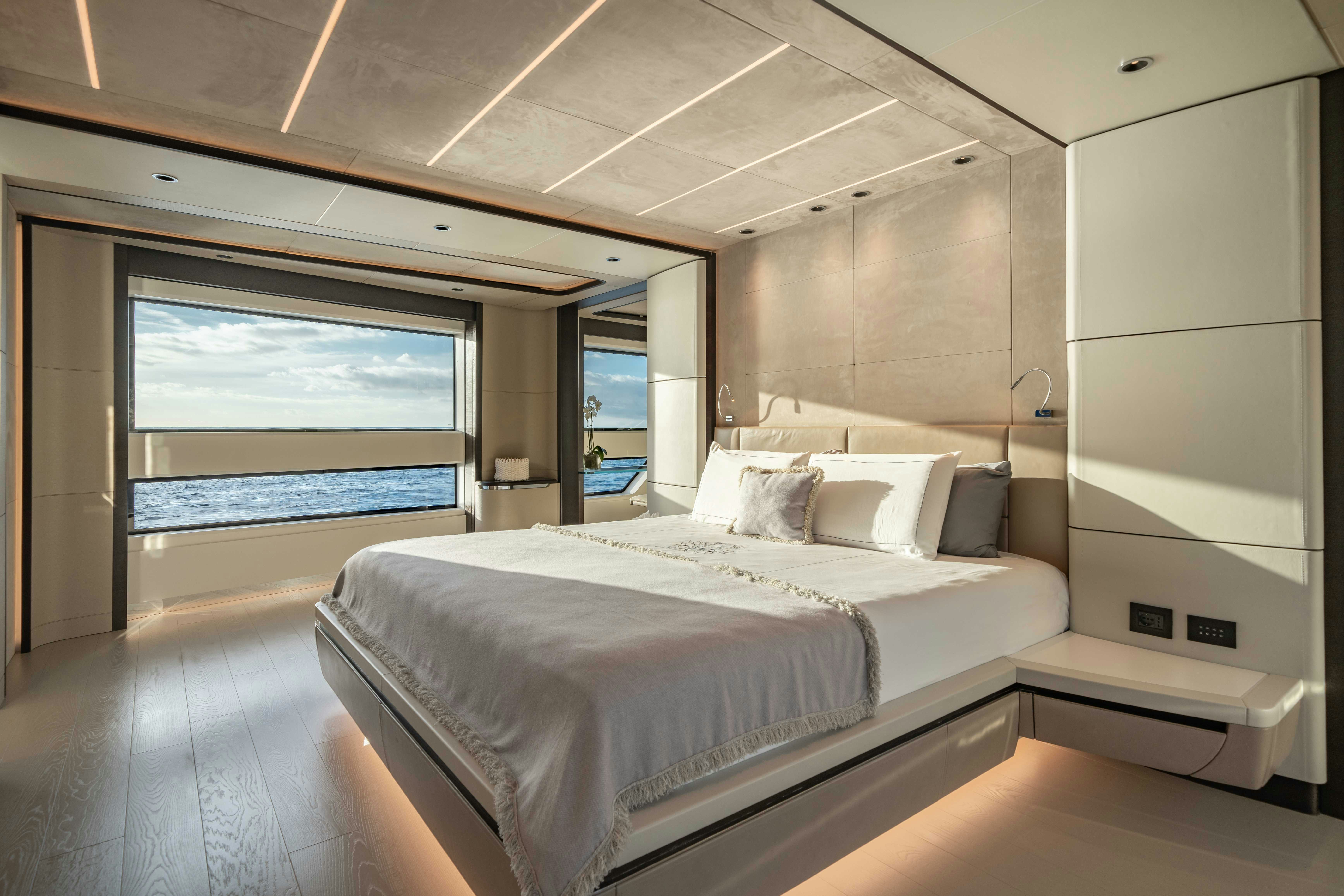 a large bedroom with a large bed aboard OCEAN KING DUCALE 120 Yacht for Sale