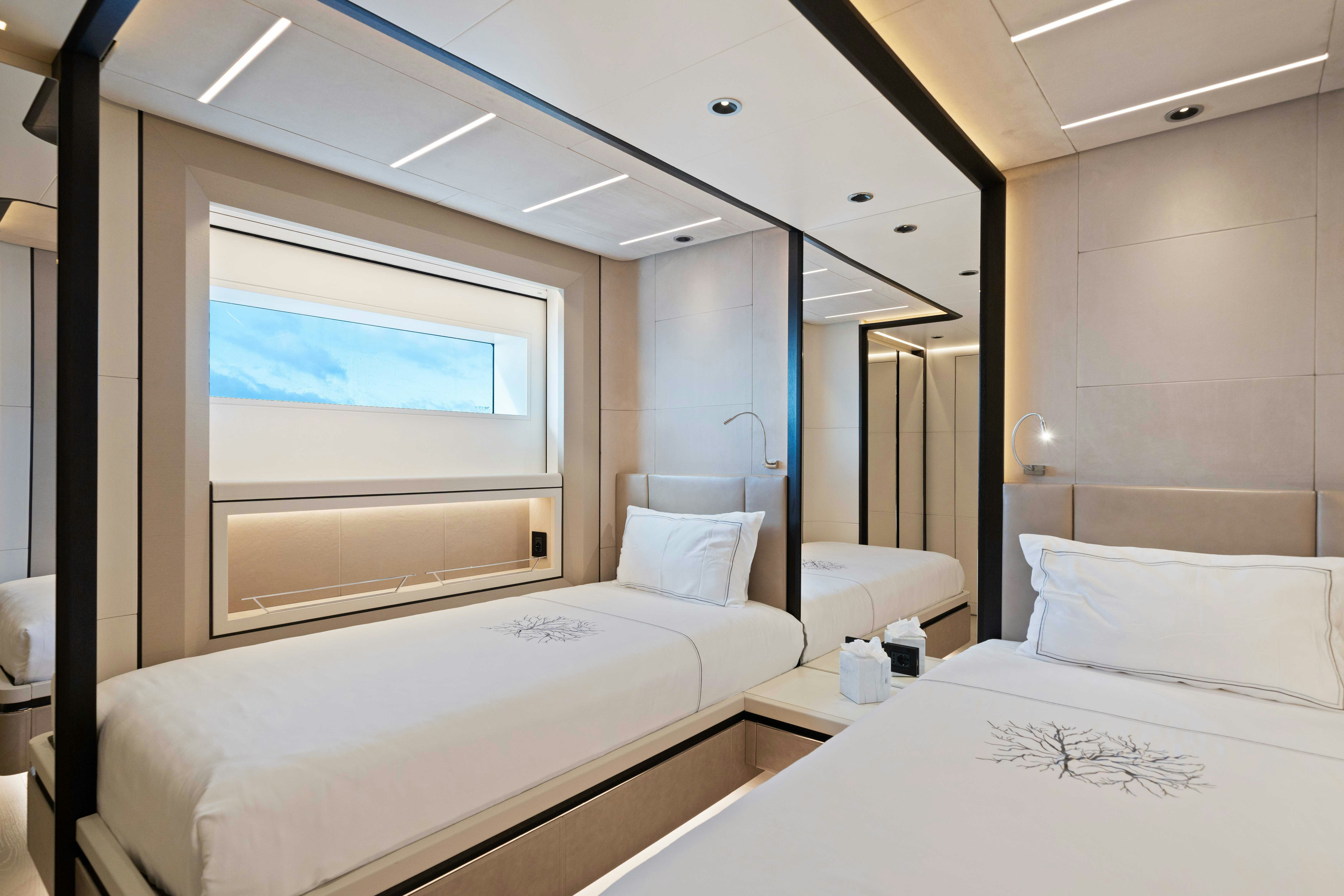a room with two beds aboard OCEAN KING DUCALE 120 Yacht for Sale
