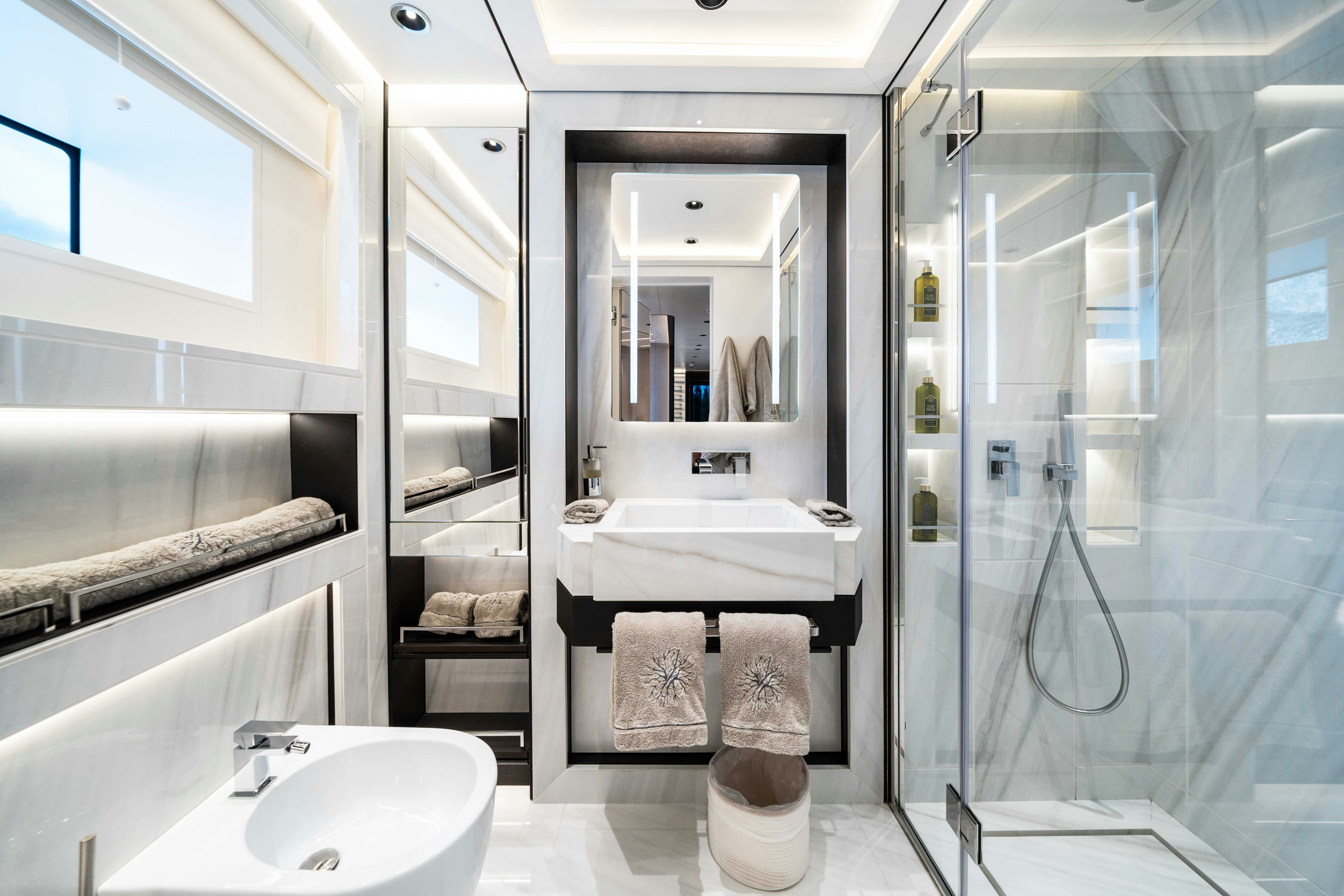 a bathroom with a glass shower aboard OCEAN KING DUCALE 120 Yacht for Sale