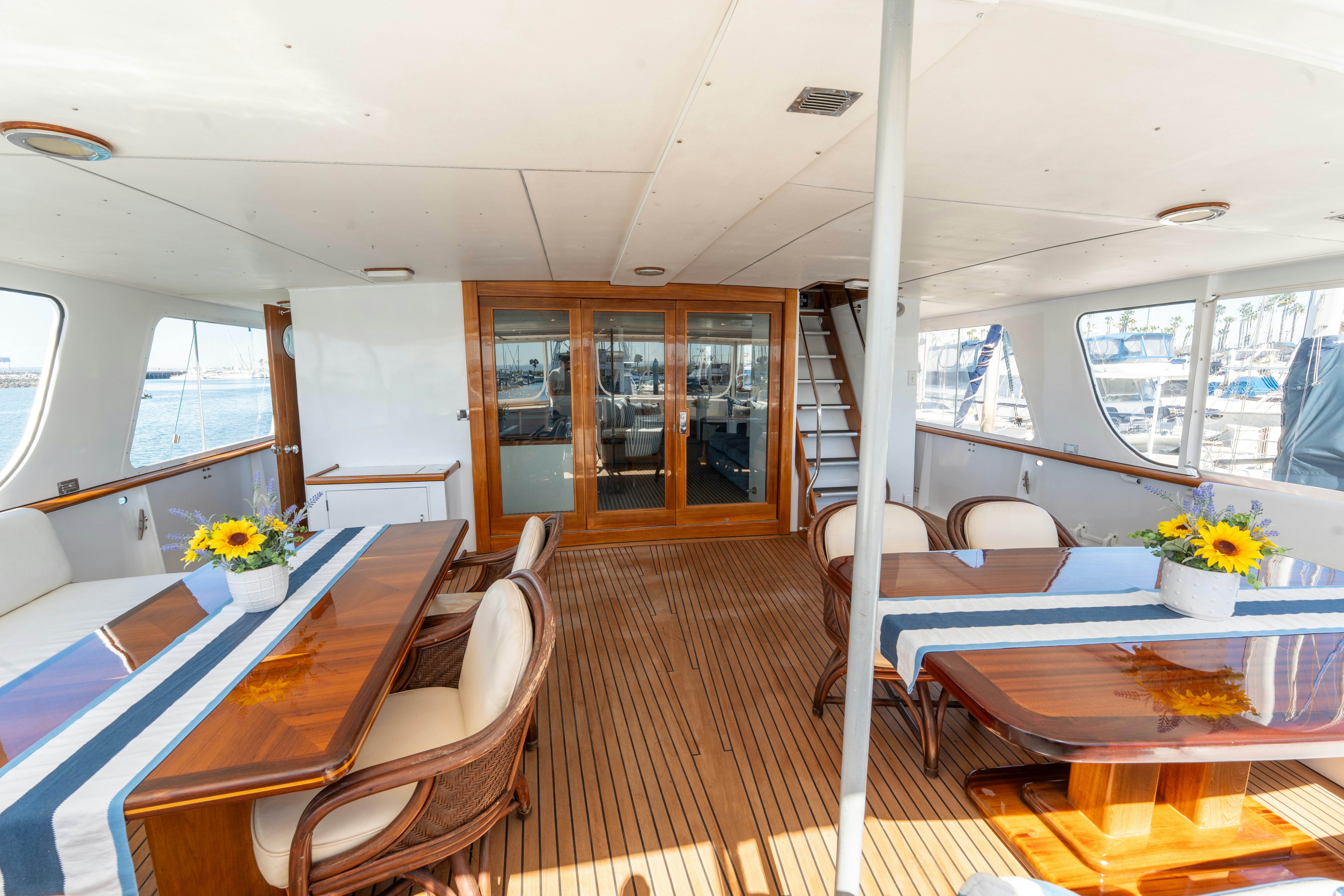 a room with a table chairs and a bed aboard NORDIC STAR Yacht for Sale