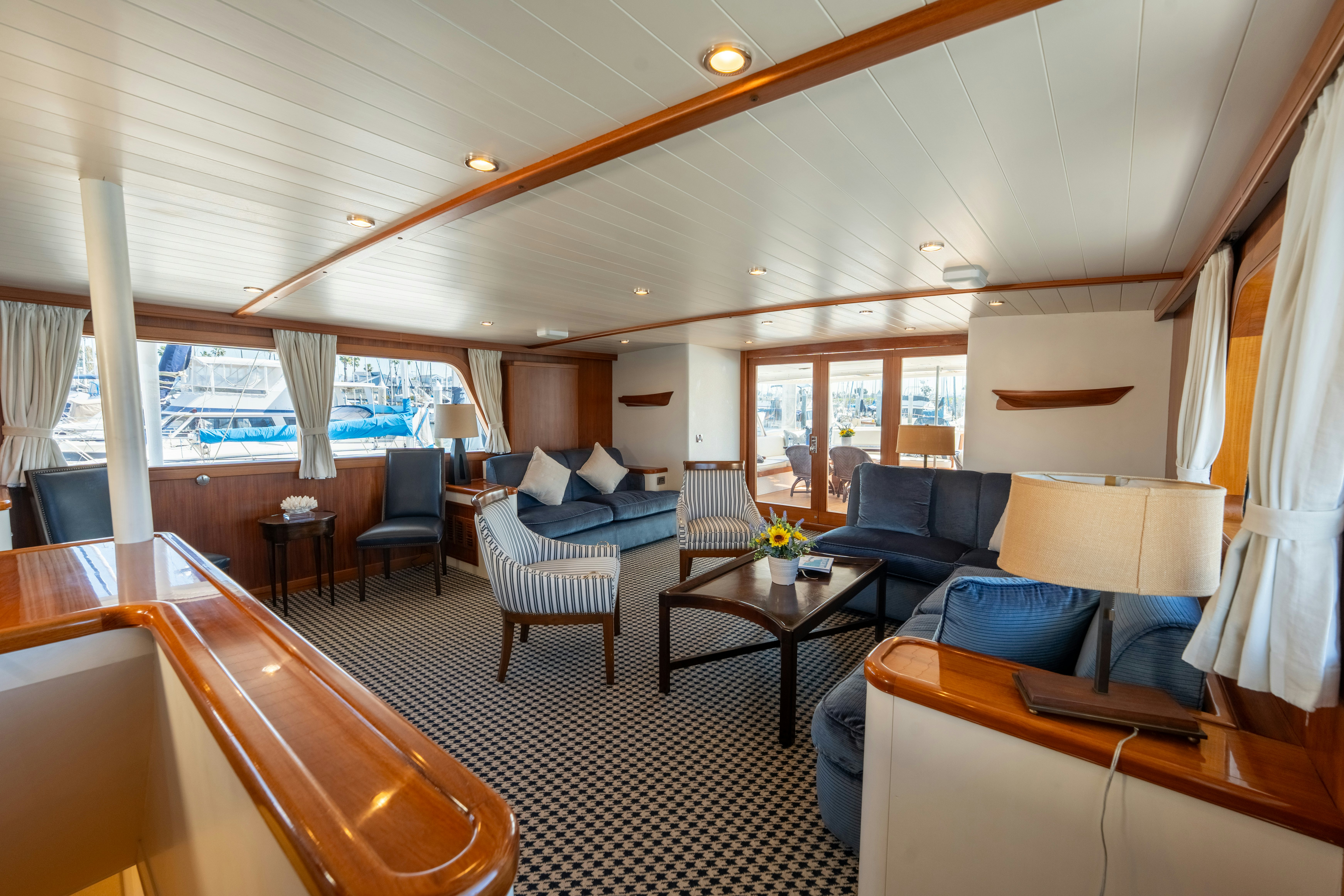 a large living room with a large window aboard NORDIC STAR Yacht for Sale