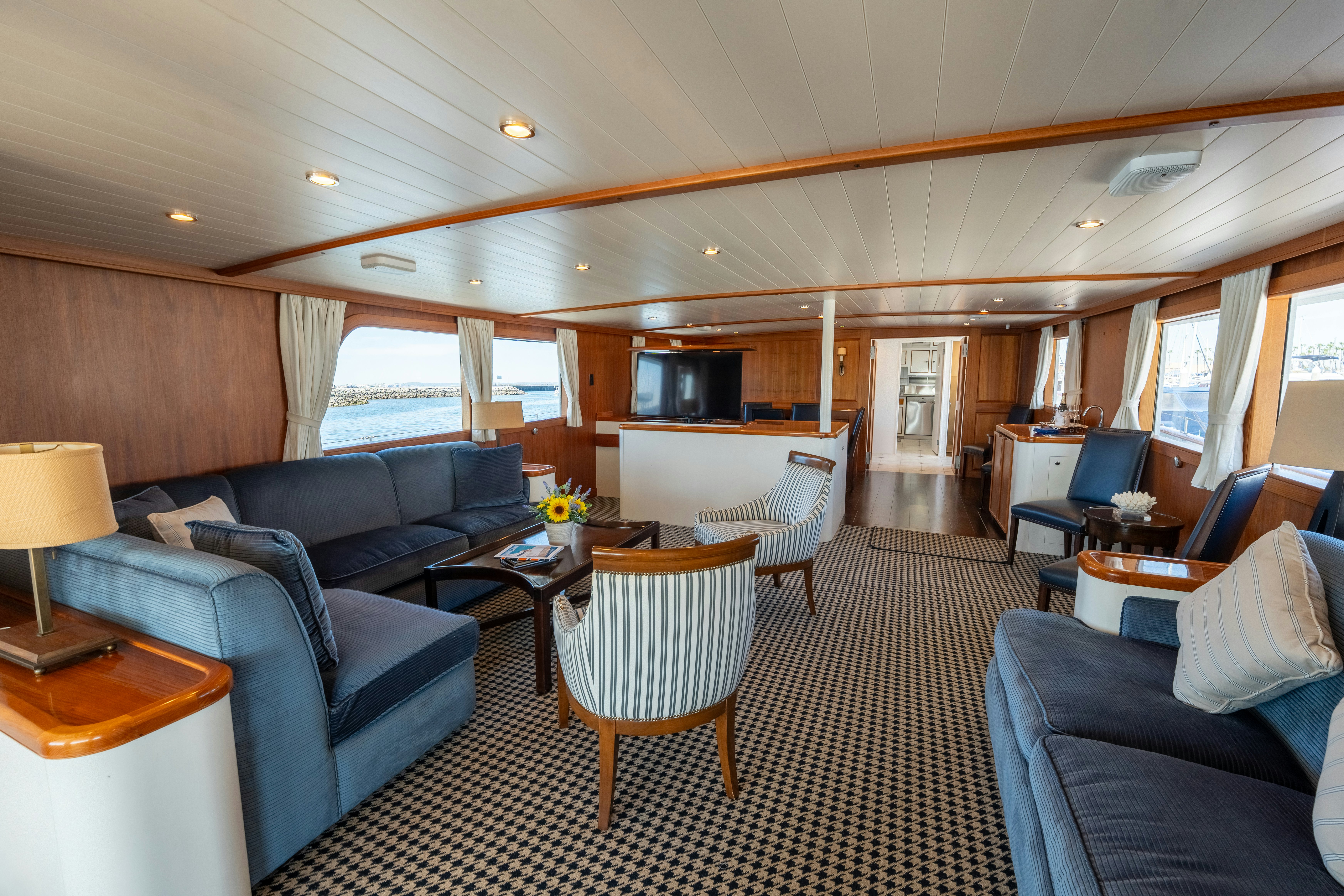 a living room with a couch and a table aboard NORDIC STAR Yacht for Sale