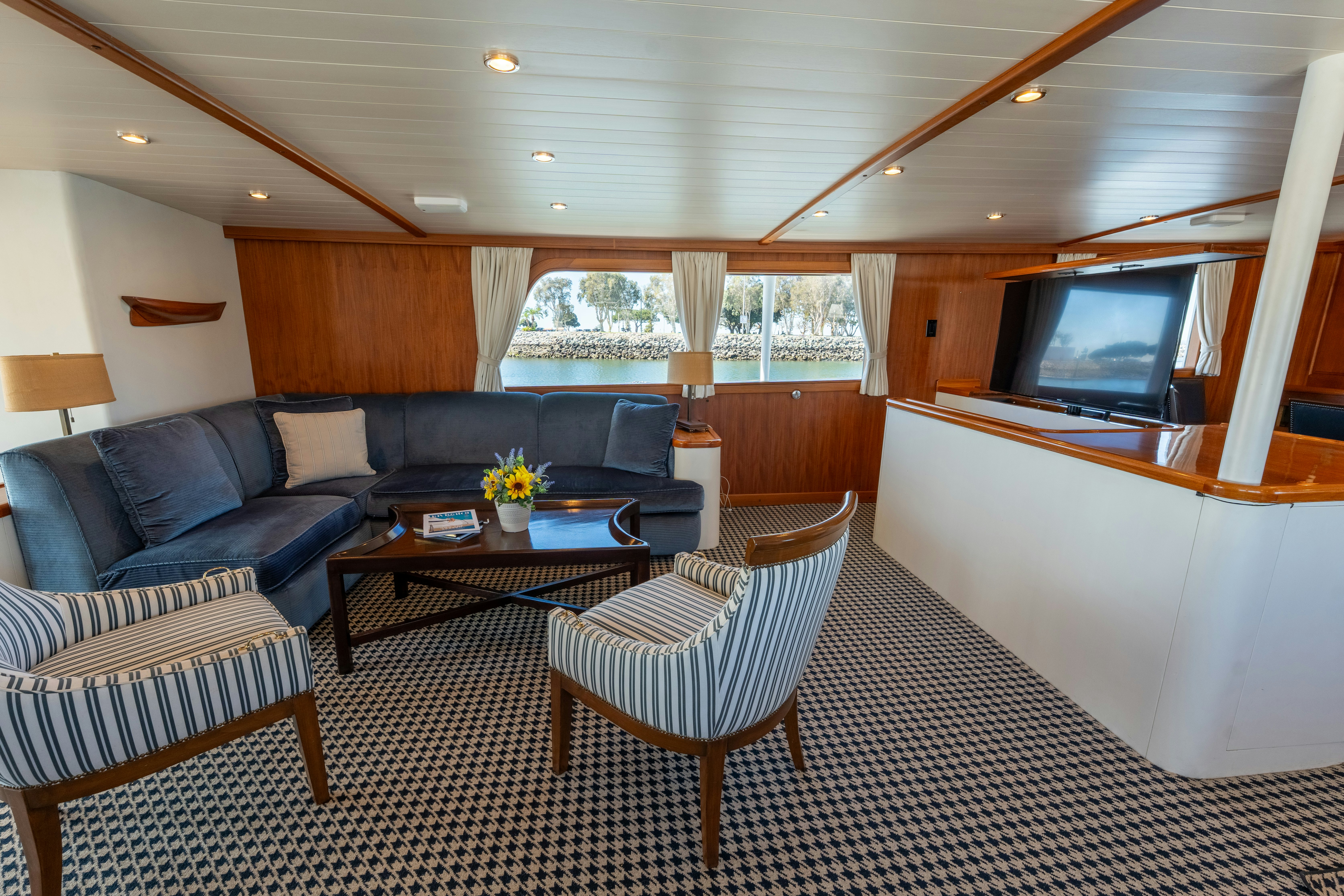 a living room with a couch and a tv aboard NORDIC STAR Yacht for Sale