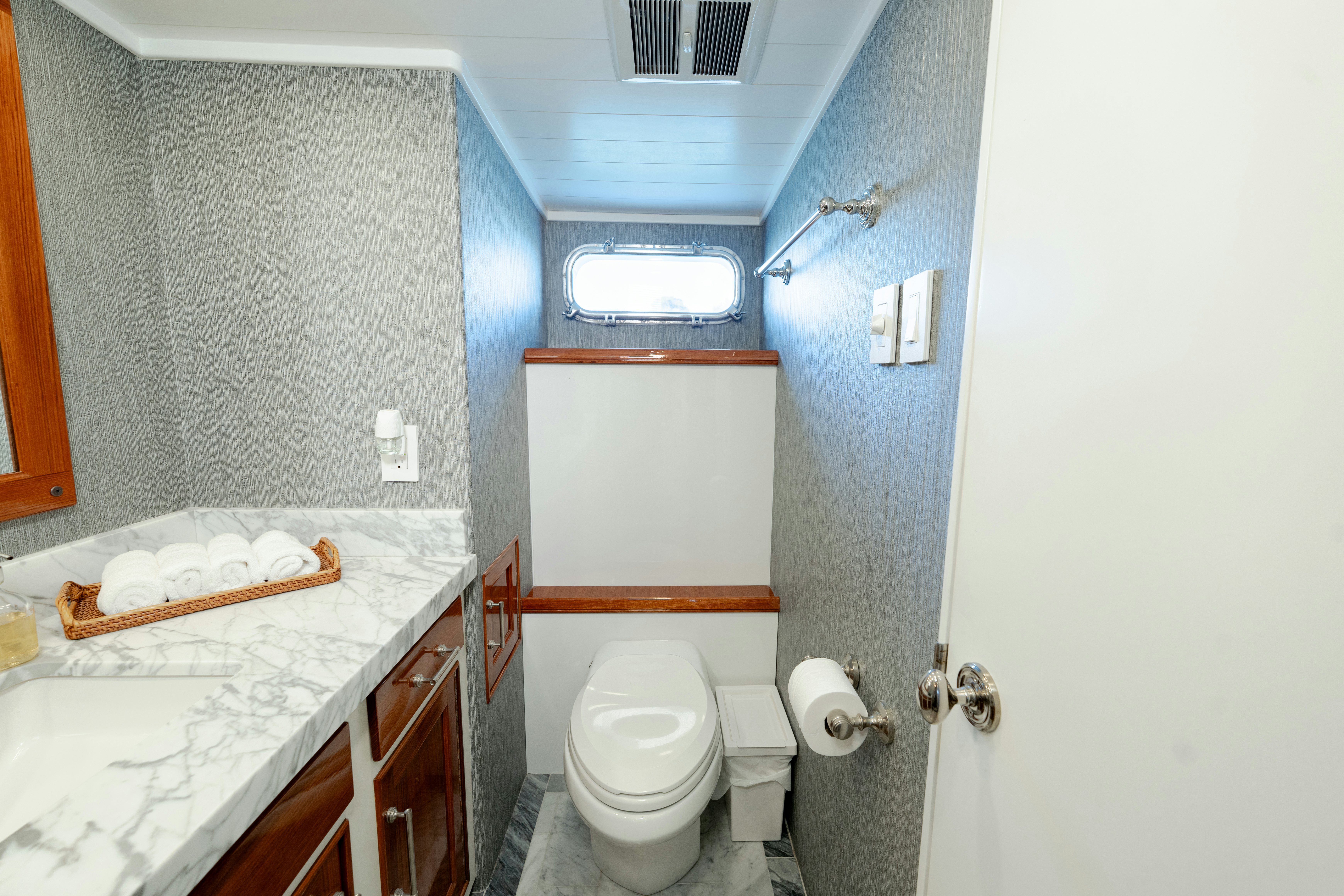 a bathroom with a toilet and a sink aboard NORDIC STAR Yacht for Sale