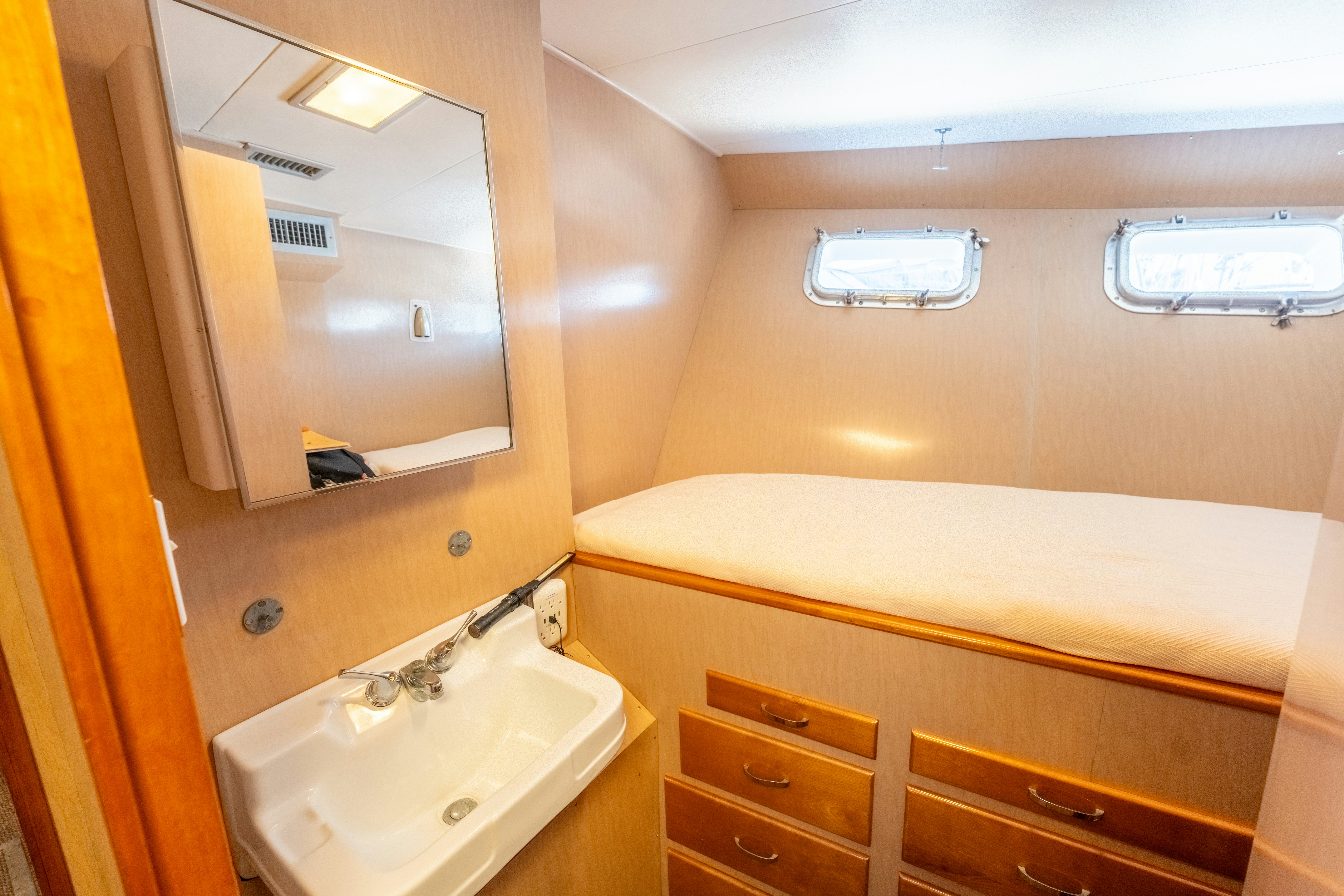 a bathroom with a tub sink and a mirror aboard NORDIC STAR Yacht for Sale