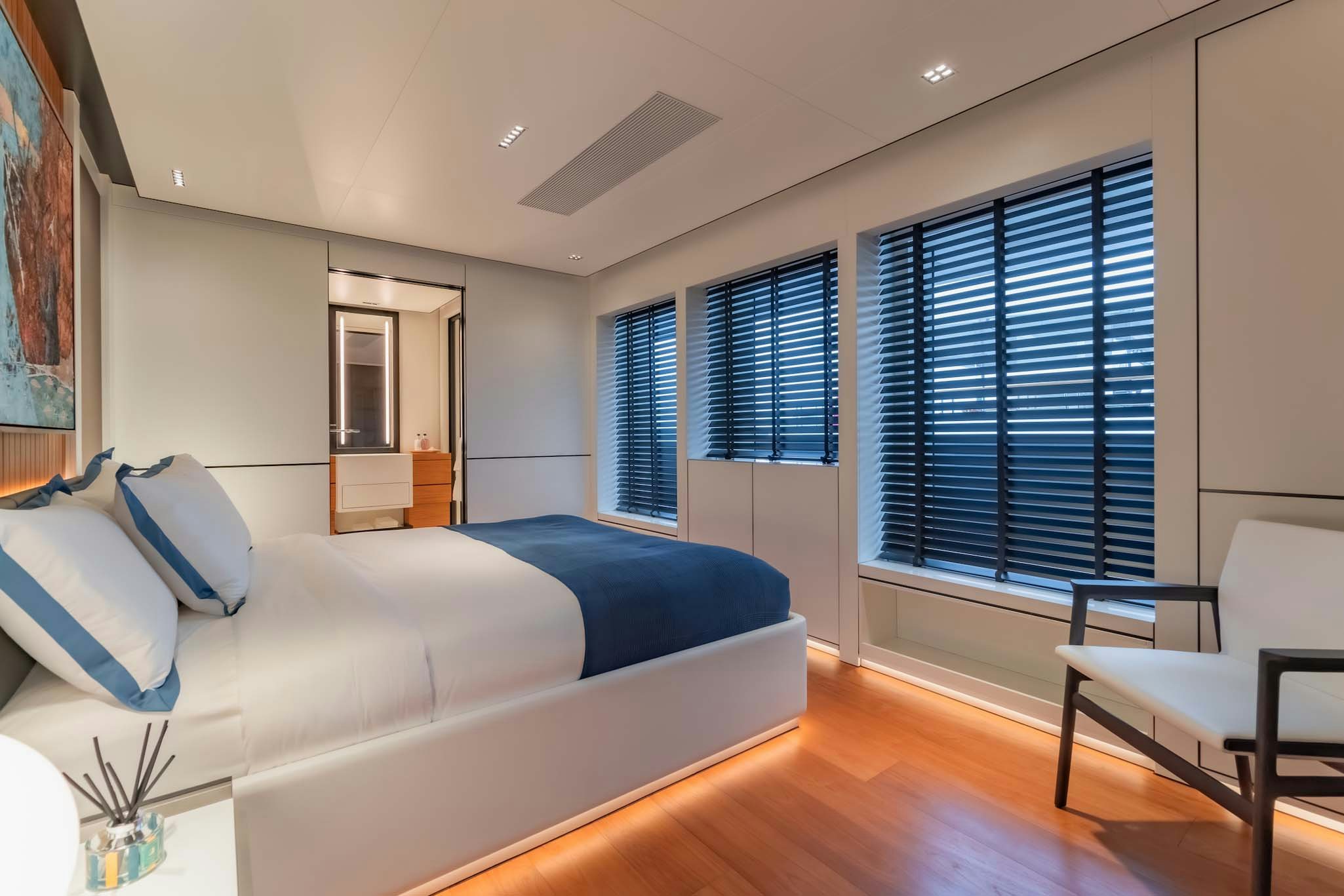 a living room with a couch and a window aboard SPACECAT Yacht for Charter