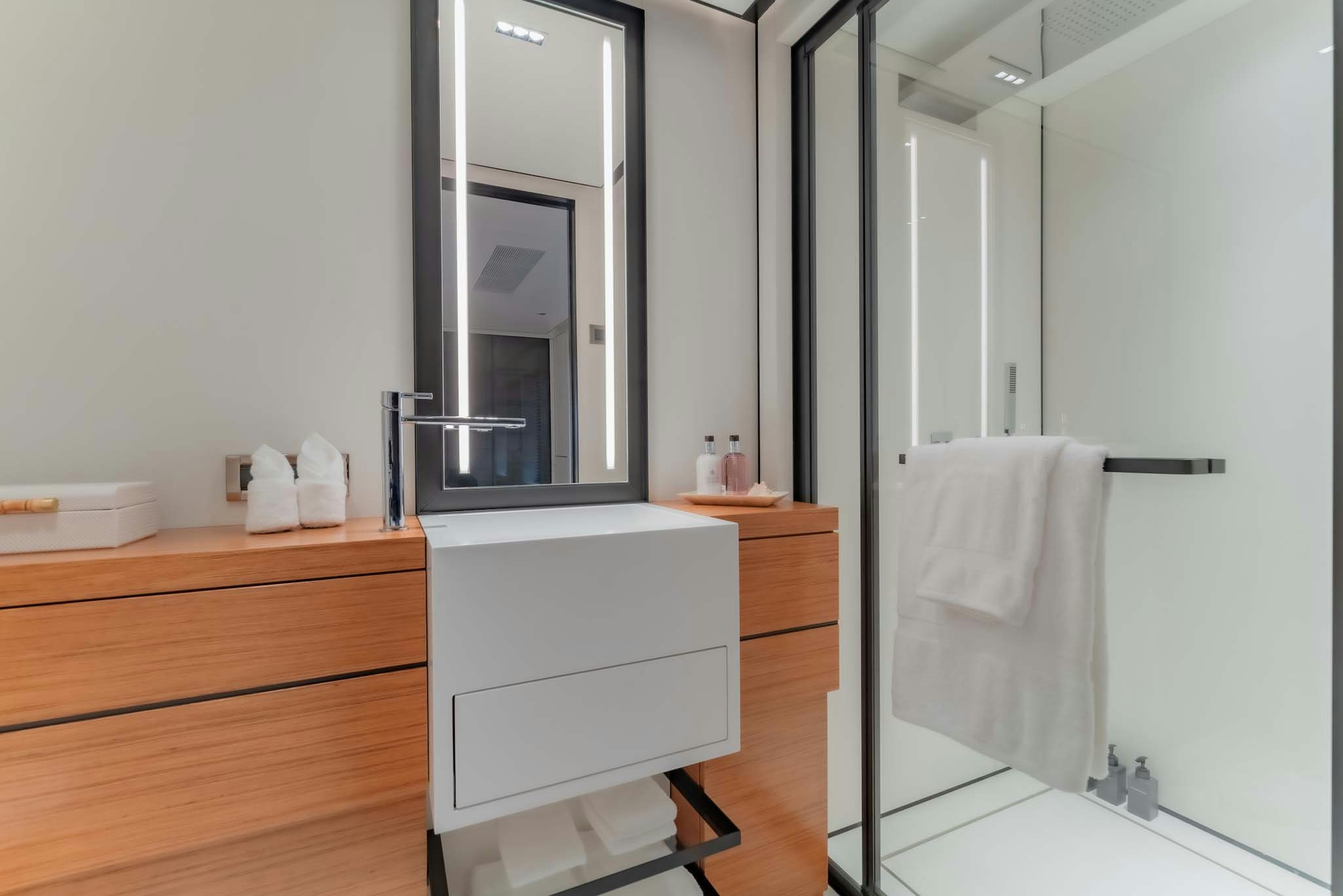 a bathroom with a standup shower aboard SPACECAT Yacht for Charter