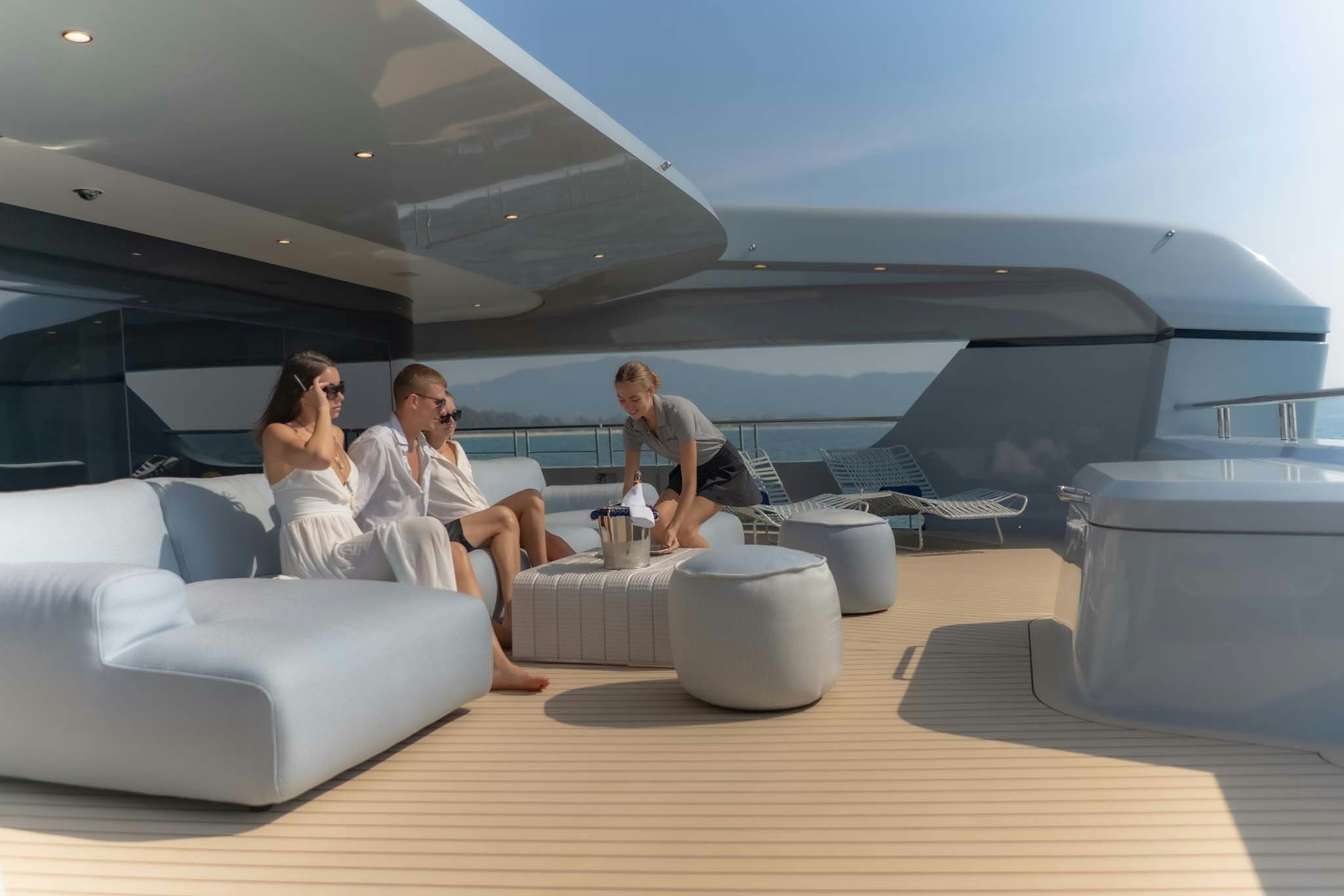 a group of people sitting around a table aboard SPACECAT Yacht for Charter