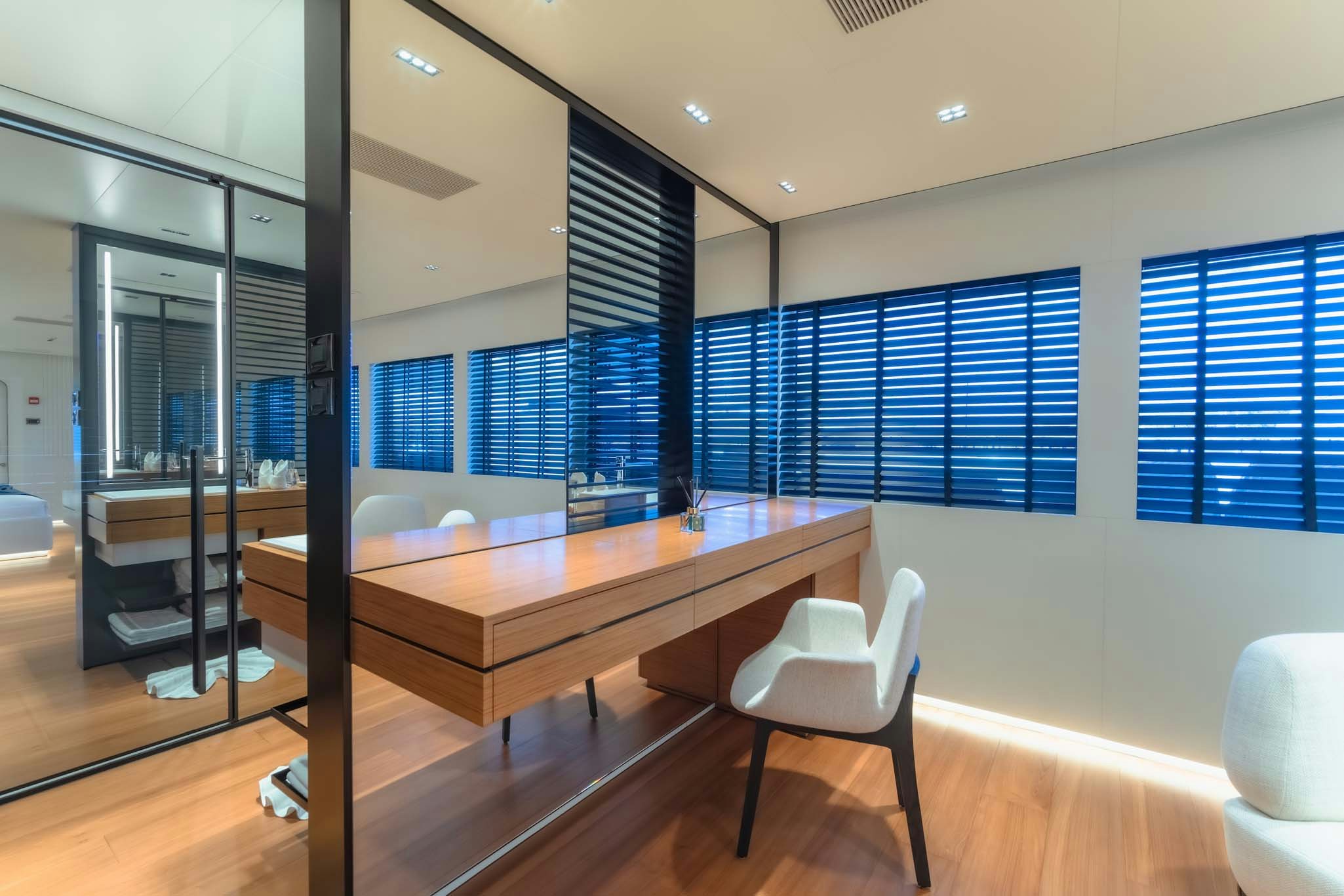 a room with a table and chairs aboard SPACECAT Yacht for Charter