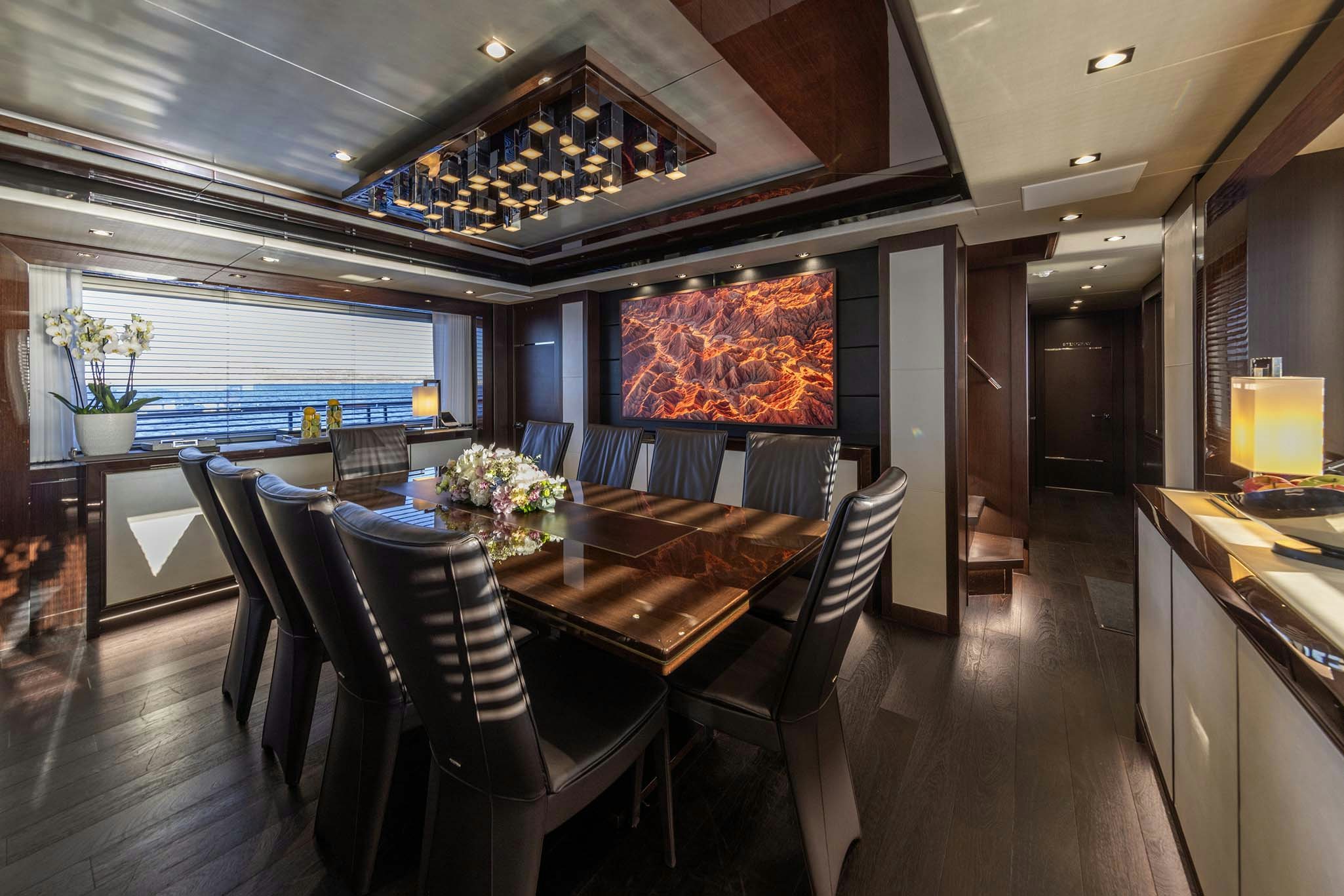 a large dining room with a large table and chairs aboard NOROADER Yacht for Charter