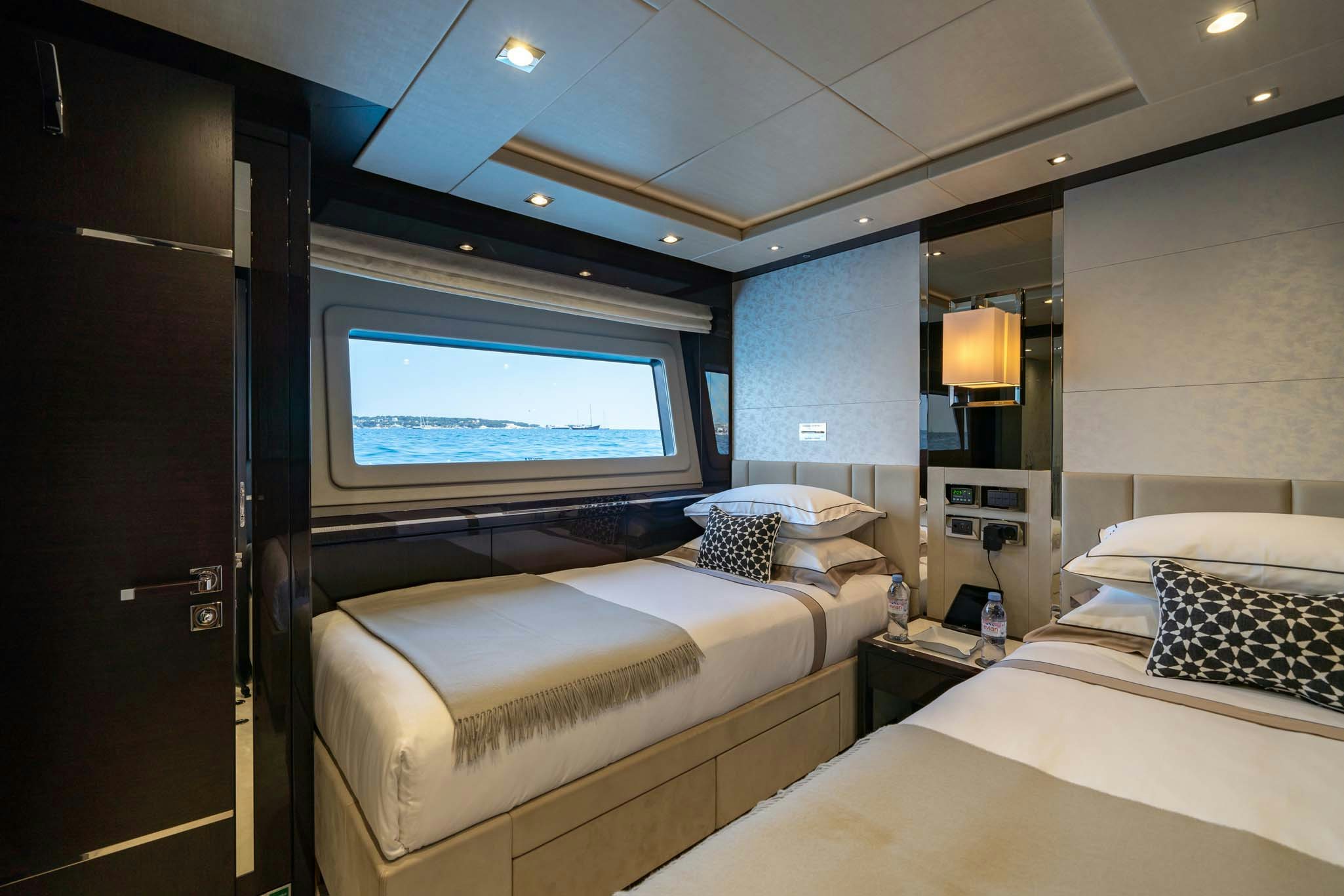 a room with two beds aboard NOROADER Yacht for Charter