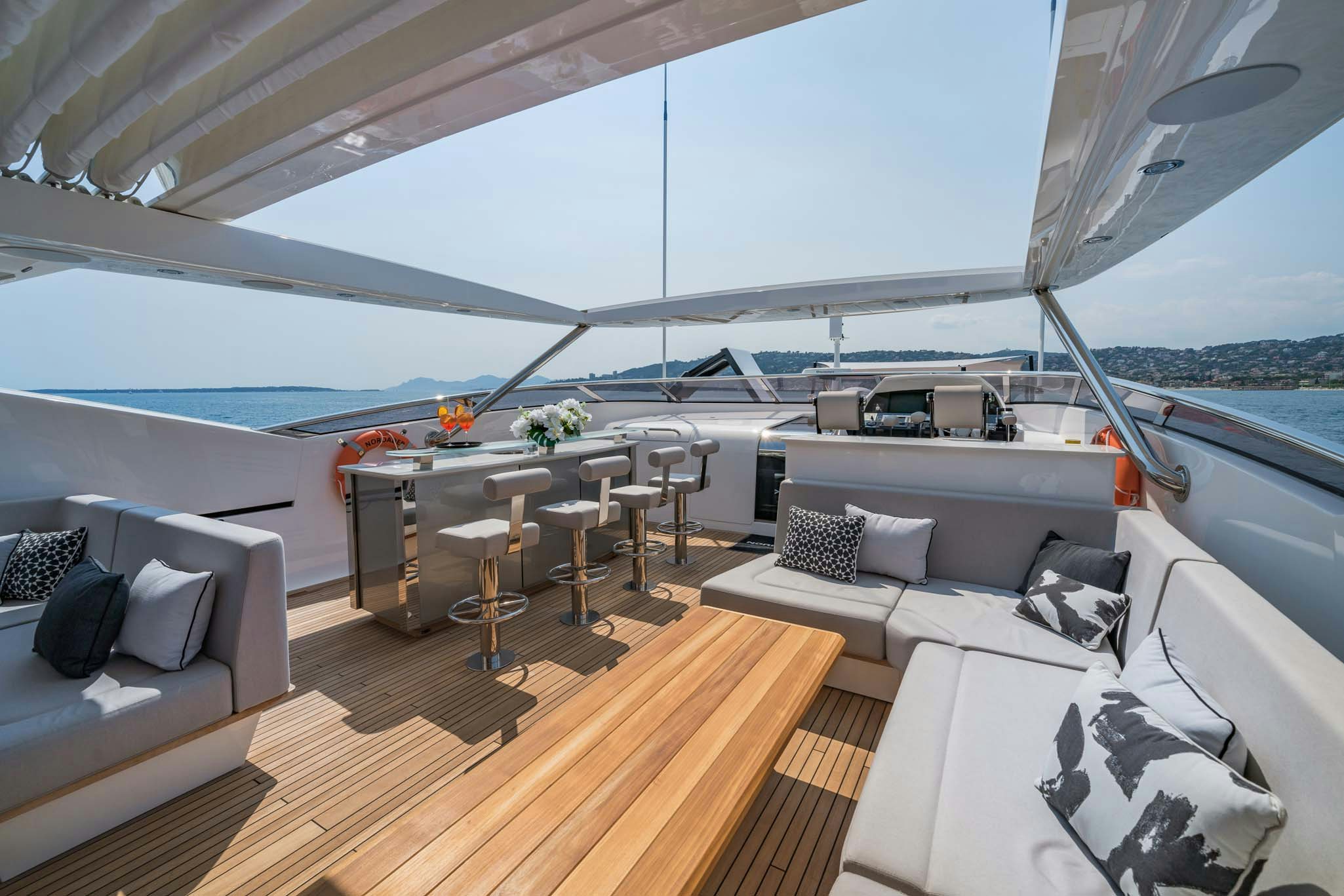 a large living room with a large window aboard NOROADER Yacht for Charter
