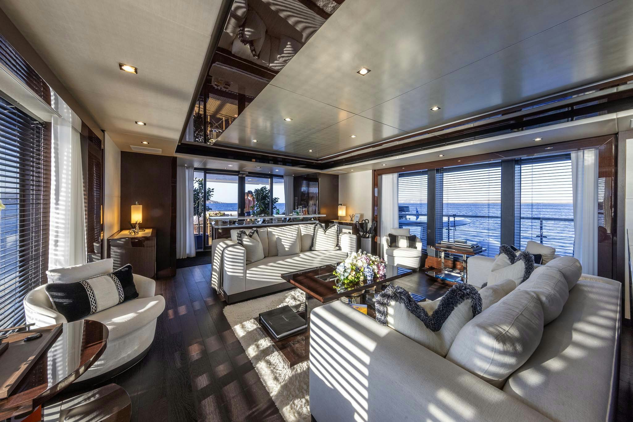 a living room with a large window aboard NOROADER Yacht for Charter