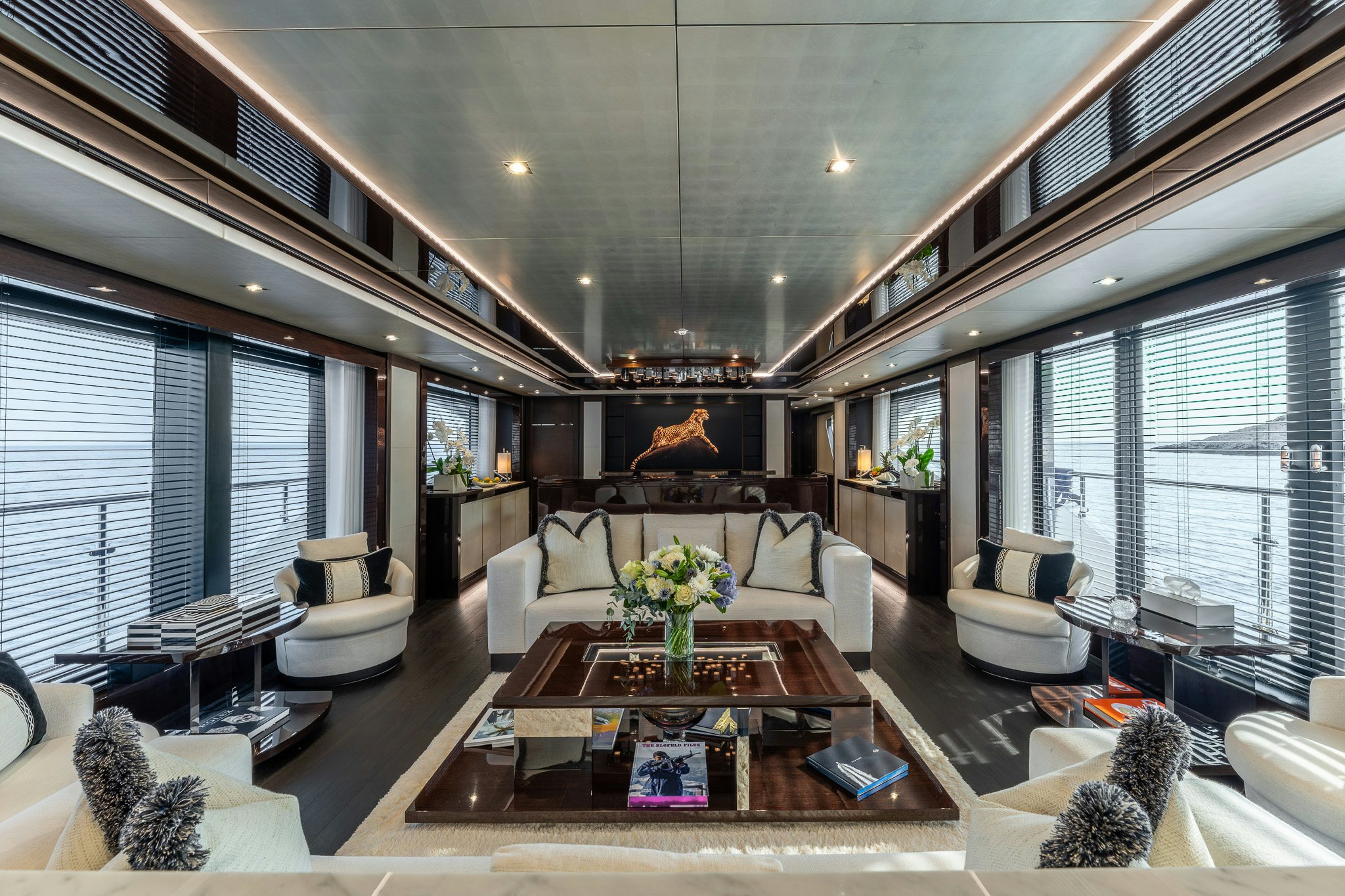 a living room with a large window aboard NOROADER Yacht for Sale