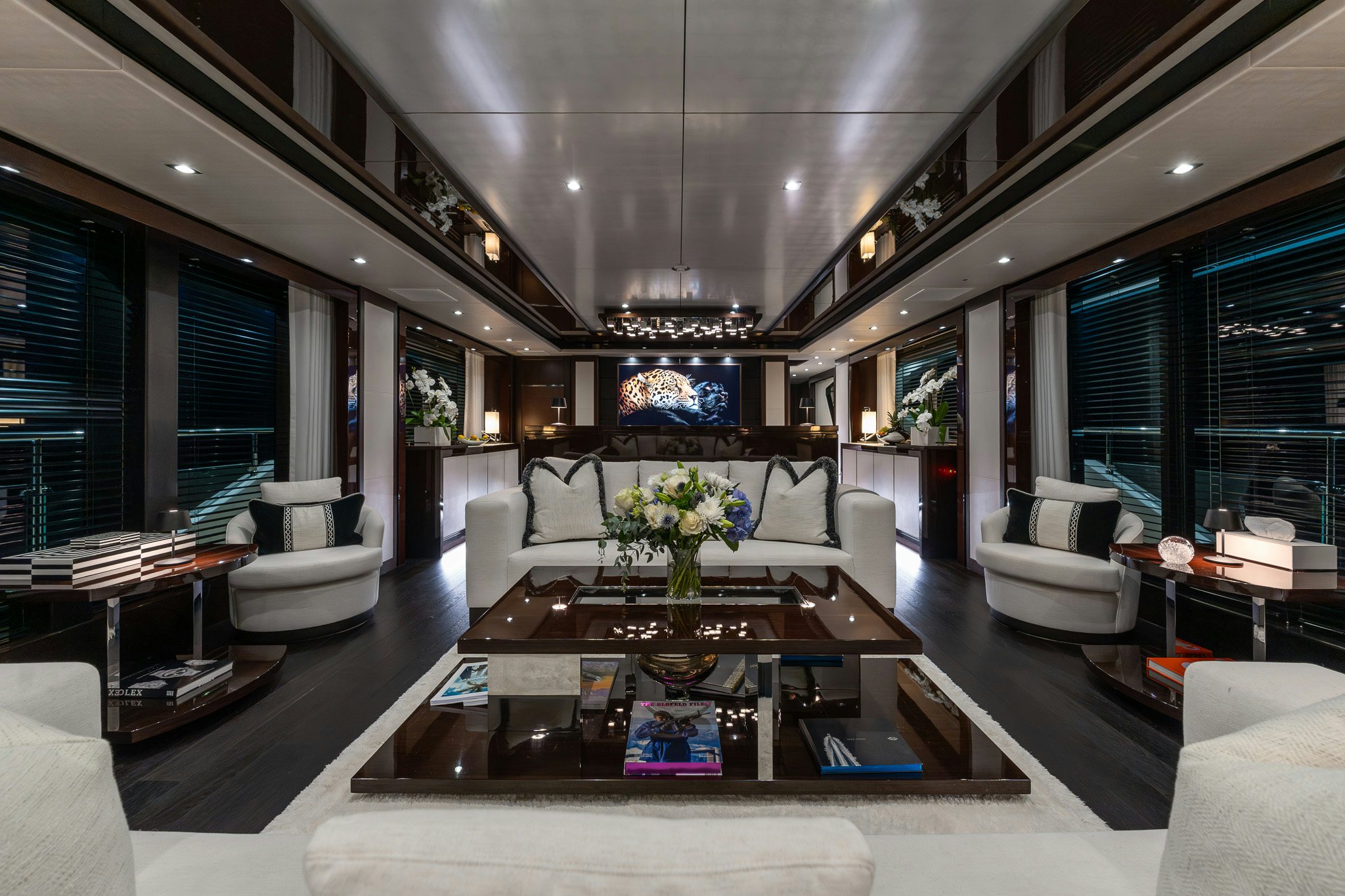 a living room with a large table aboard NOROADER Yacht for Sale