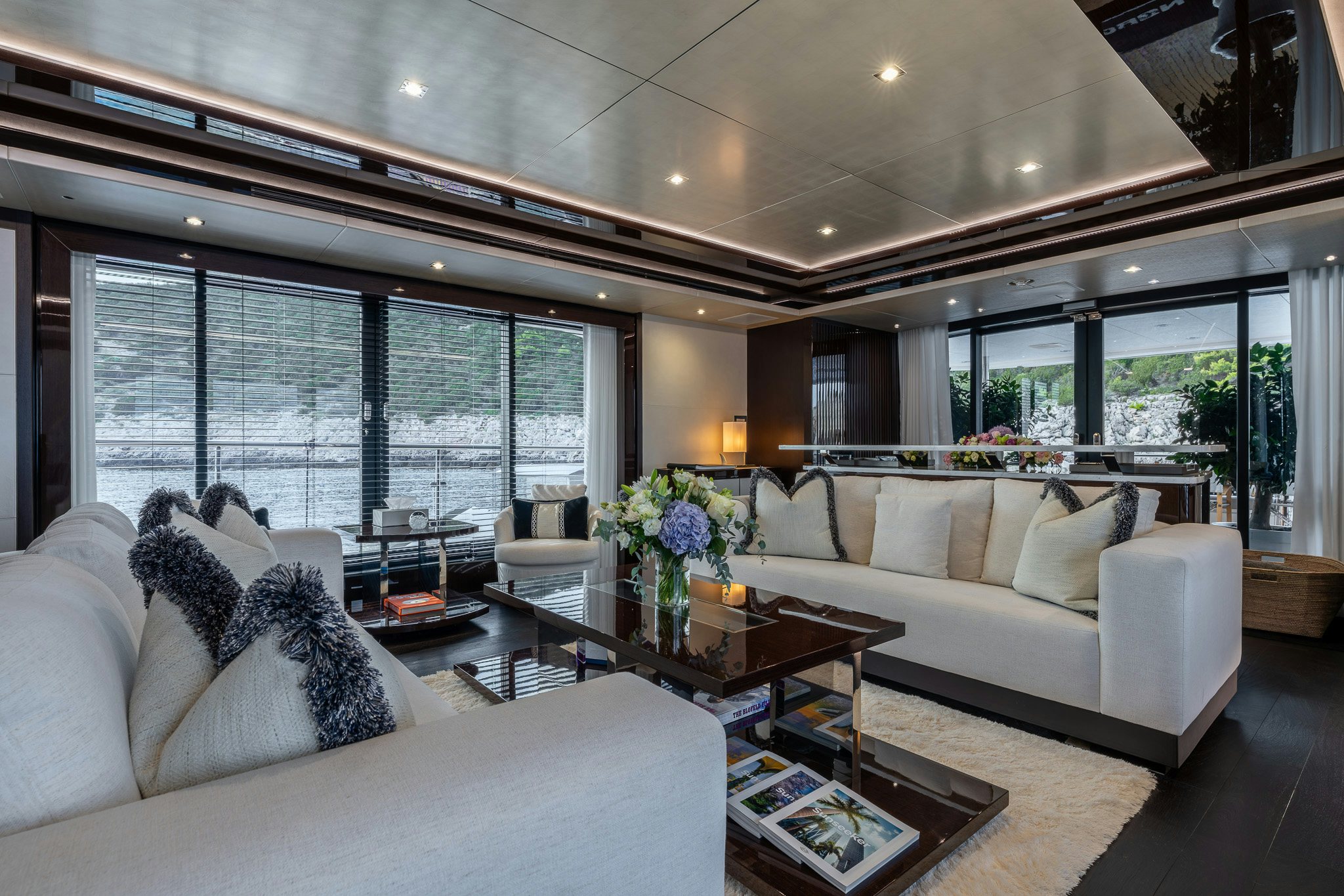 a living room with a large window aboard NOROADER Yacht for Sale