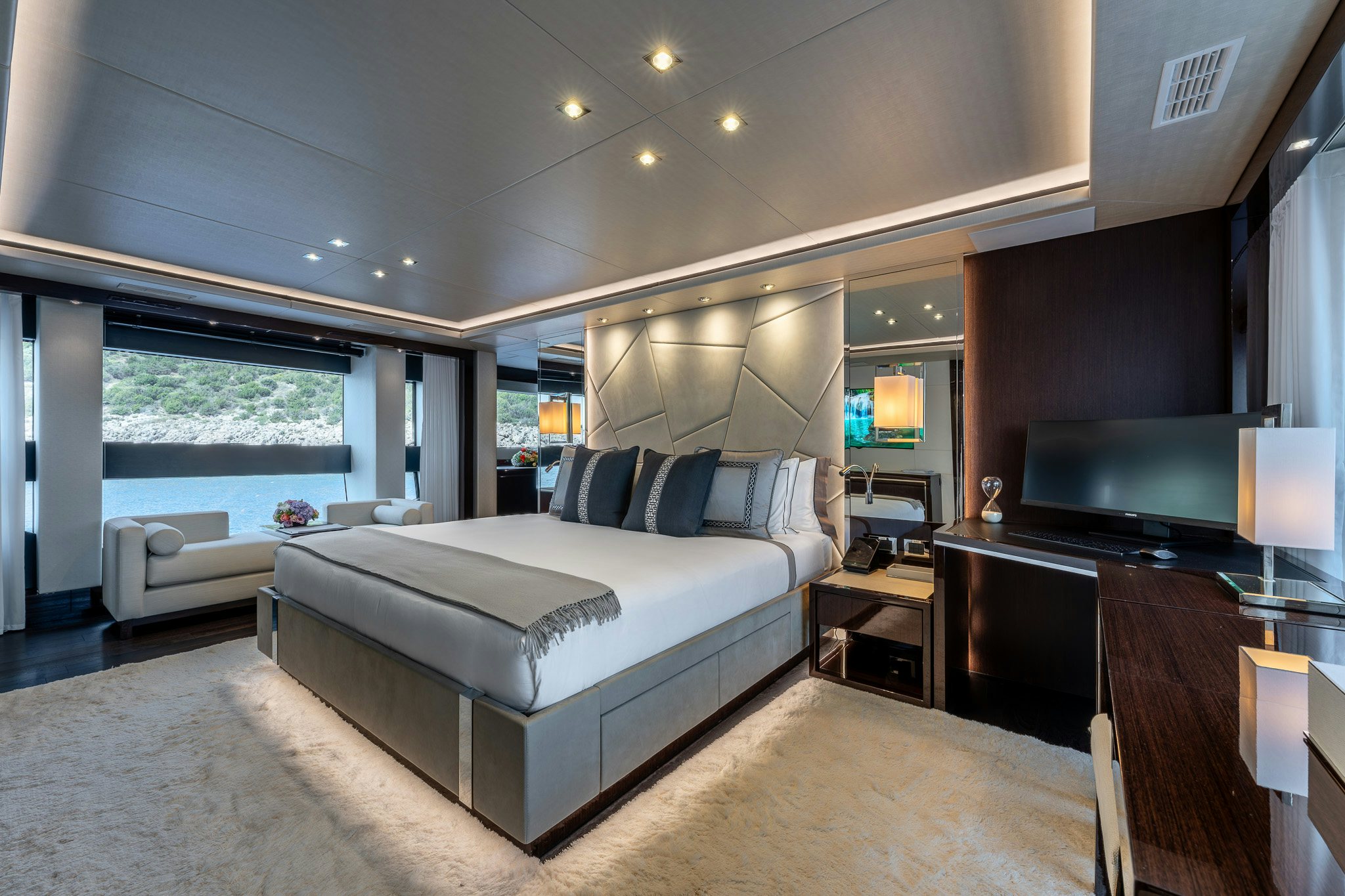 a large bedroom with a large window aboard NOROADER Yacht for Sale