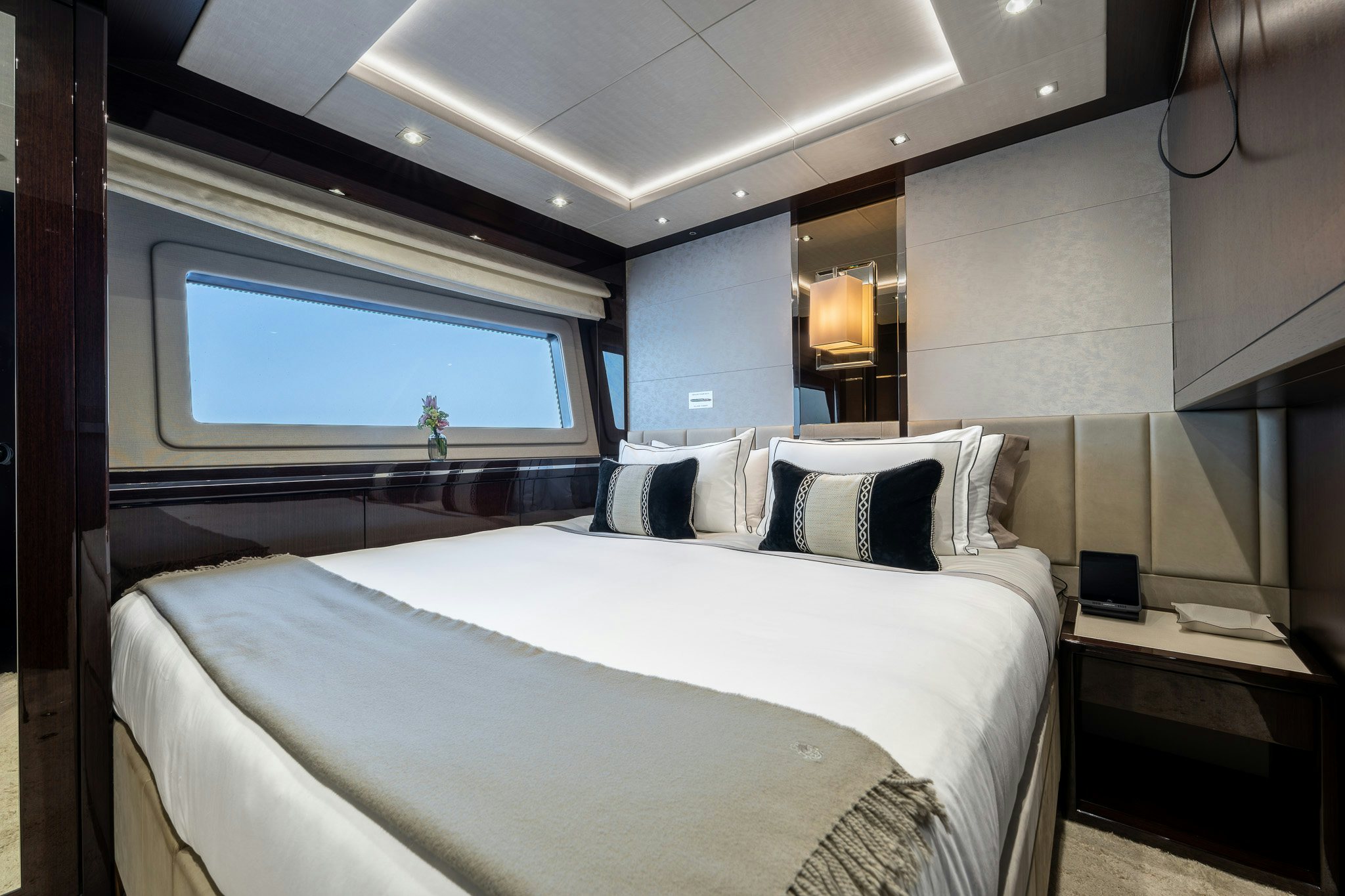 a room with a bed and a window aboard NOROADER Yacht for Sale