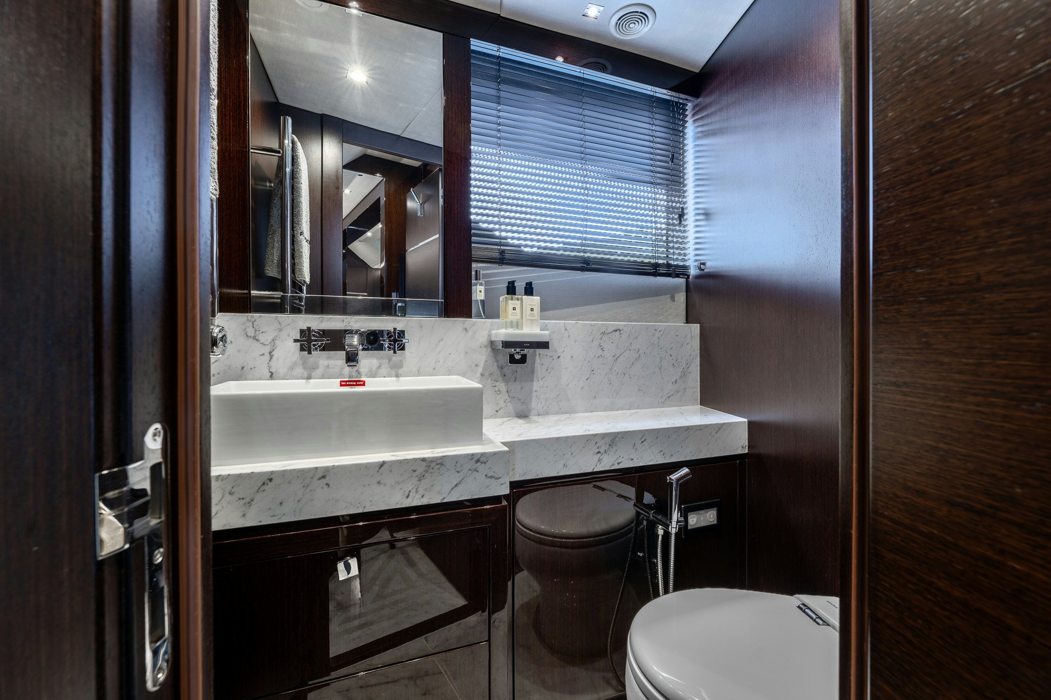 a bathroom with a sink and a toilet aboard NOROADER Yacht for Sale
