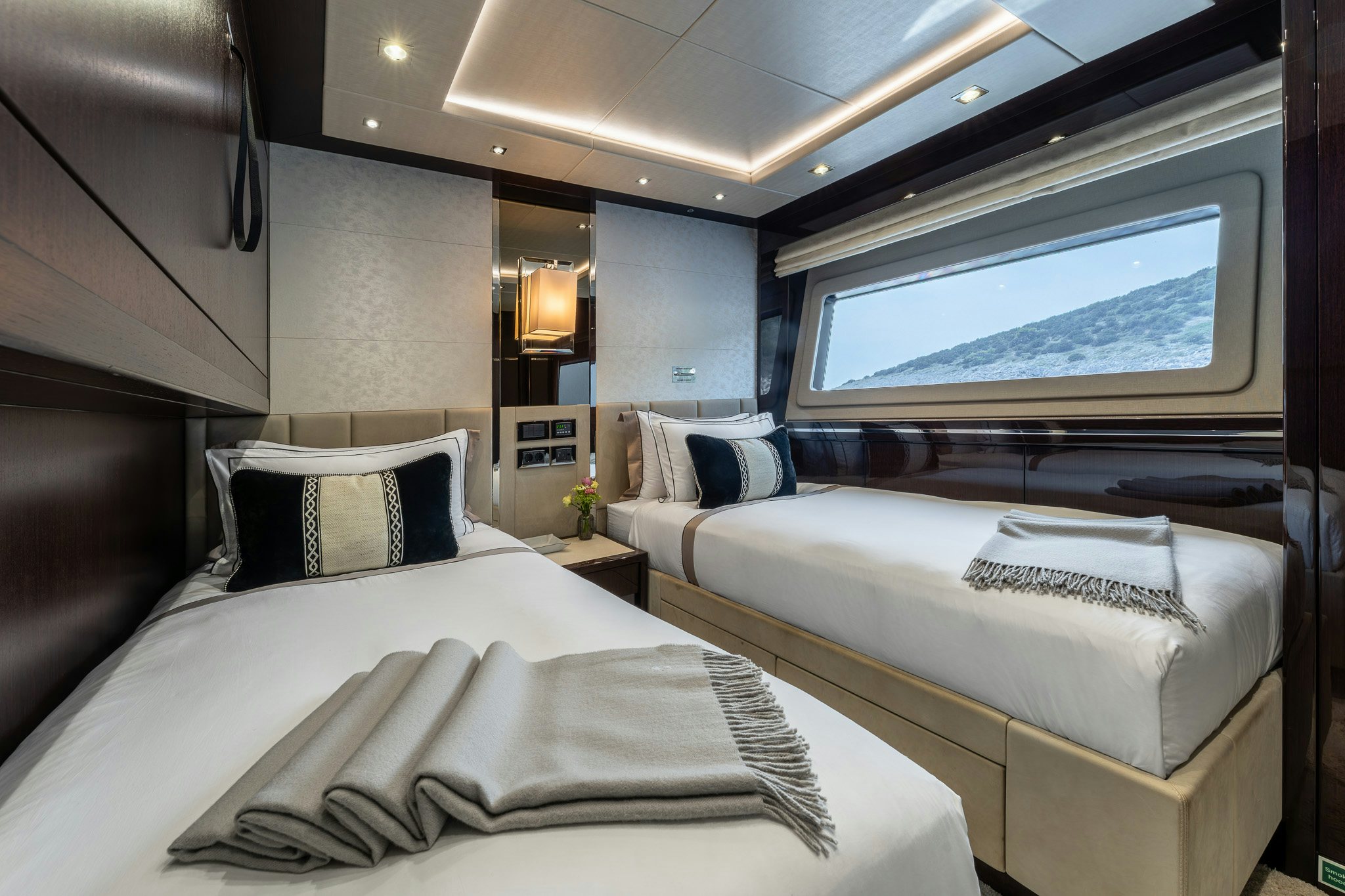 a room with two beds aboard NOROADER Yacht for Sale