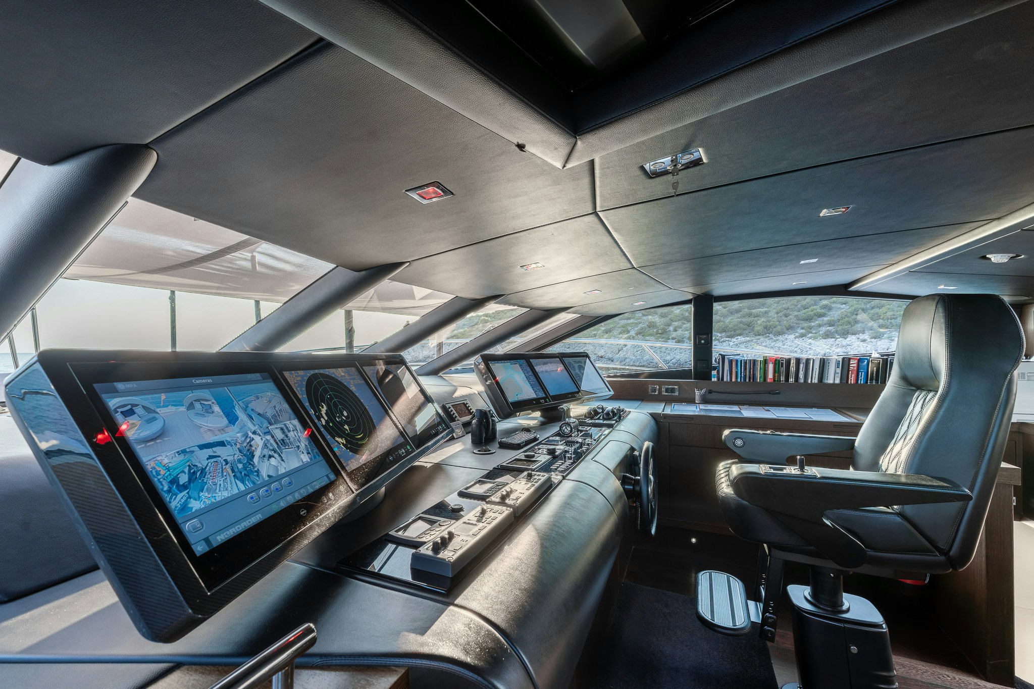 inside of a vehicle with seats and screens aboard NOROADER Yacht for Sale