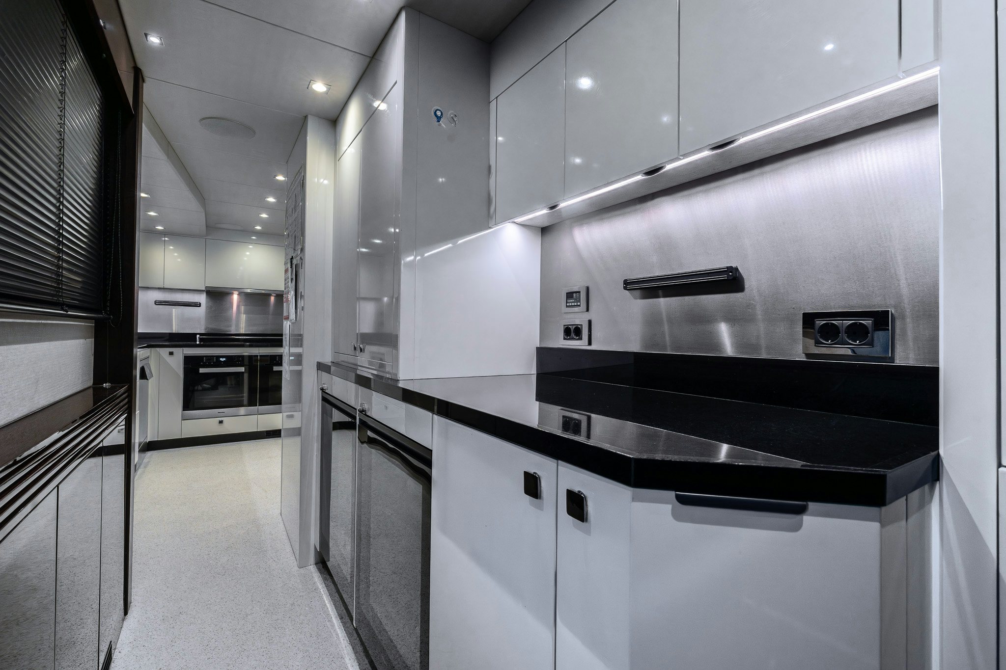 a kitchen with stainless steel appliances aboard NOROADER Yacht for Sale