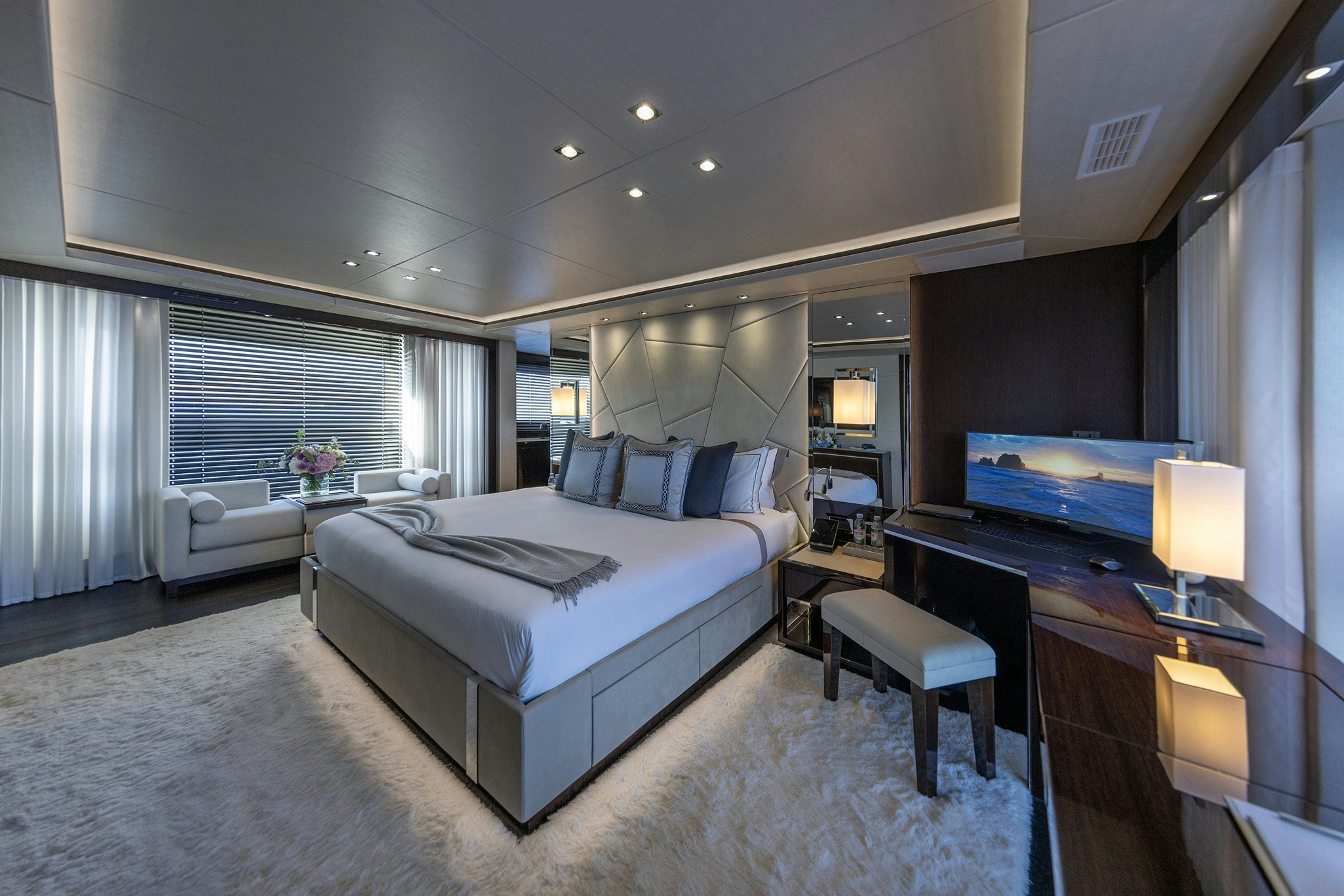 a bedroom with a large bed aboard NOROADER Yacht for Charter