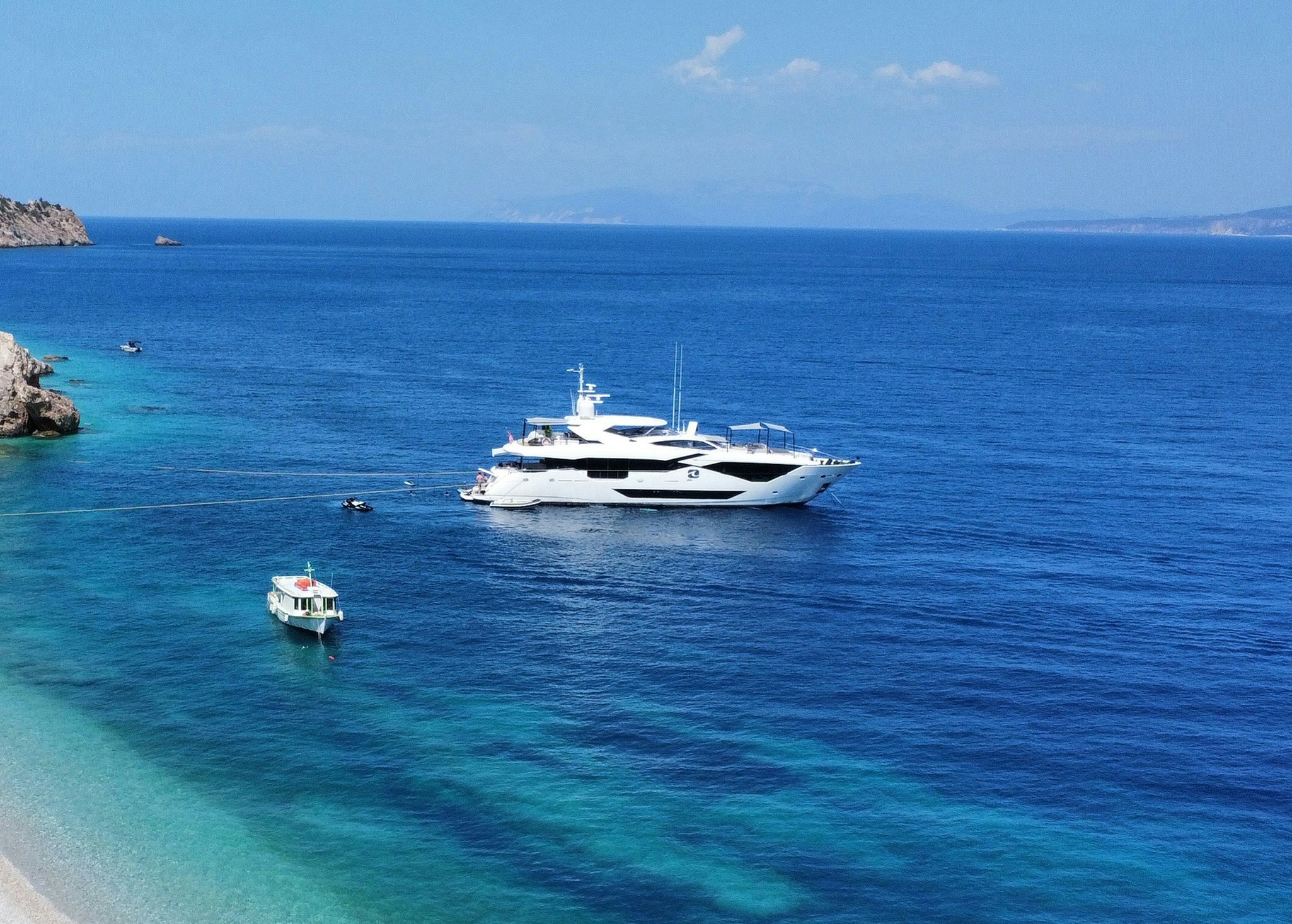 a couple of boats in the water aboard NOROADER Yacht for Charter