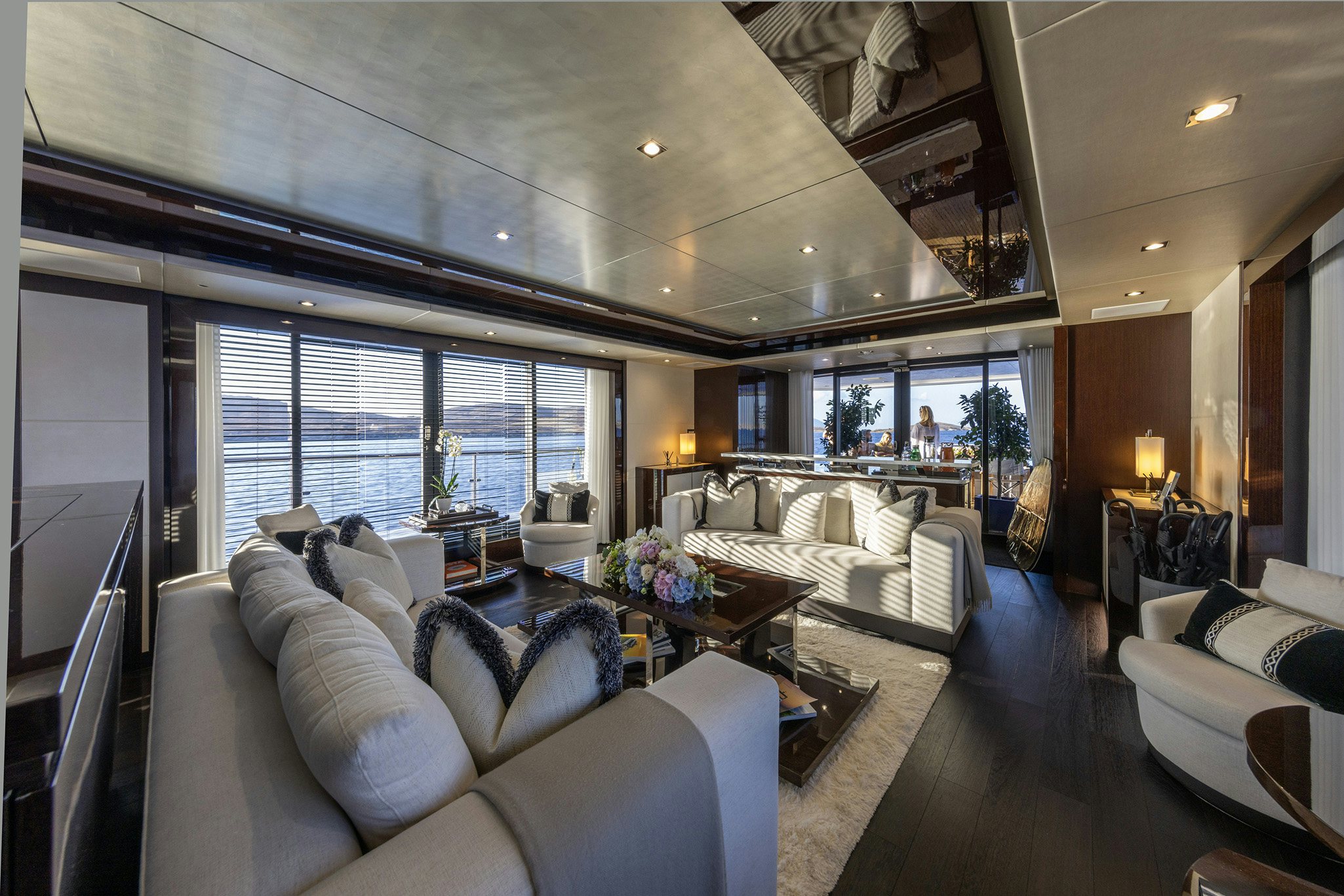 a living room with a large window aboard NOROADER Yacht for Charter