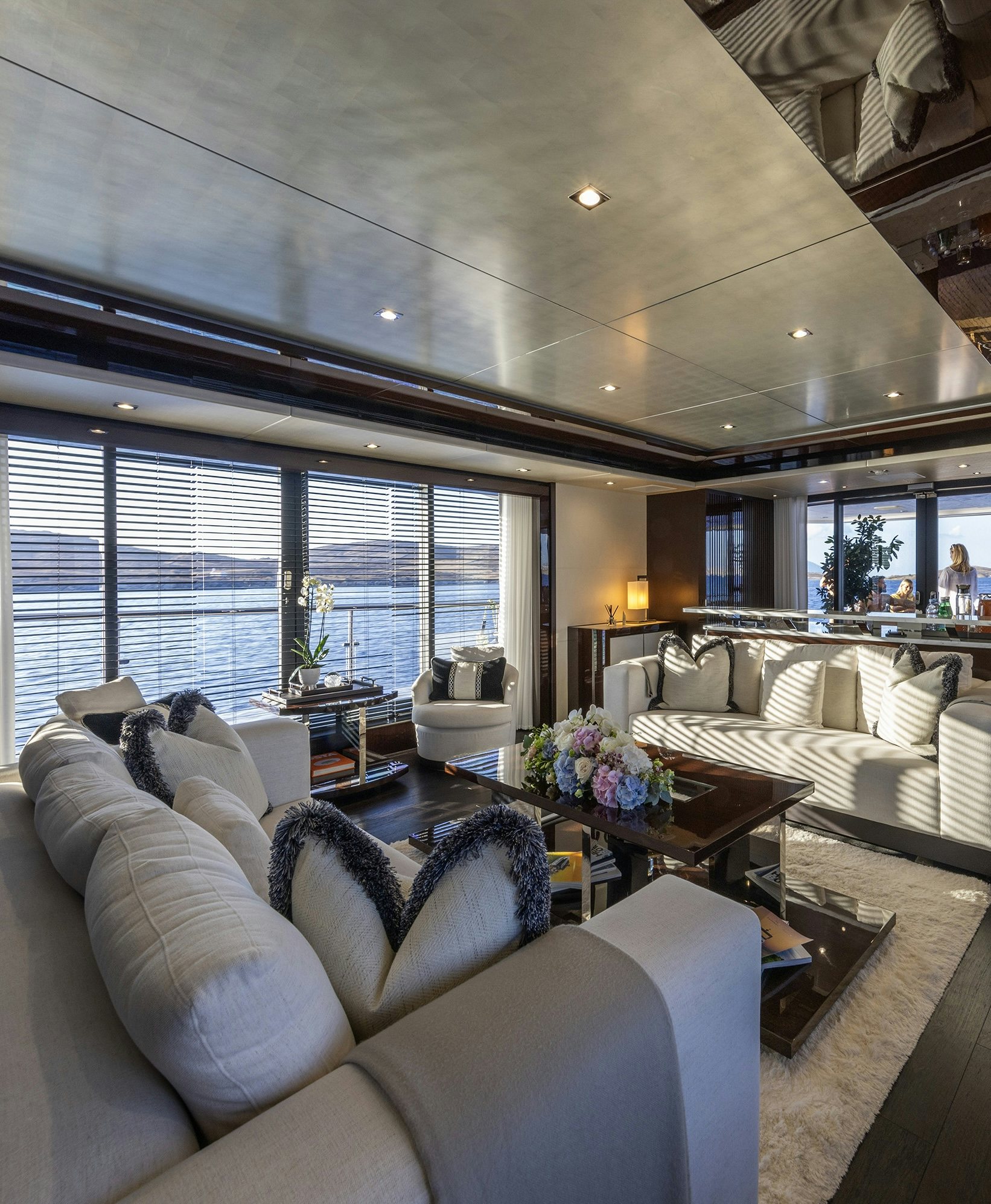 a living room with a large window aboard NOROADER Yacht for Charter