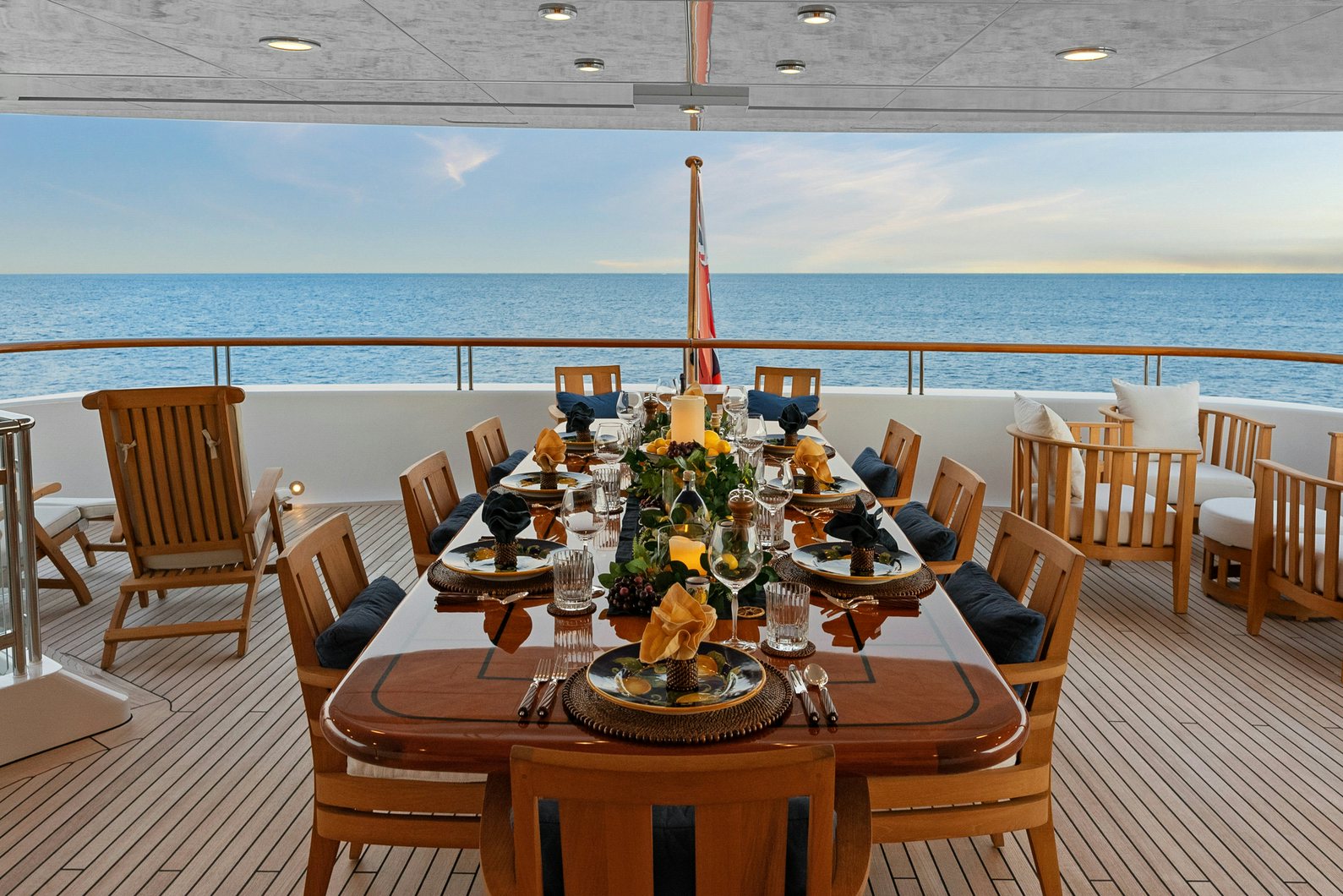 a table set for a dinner party aboard AMICA MEA Yacht for Charter