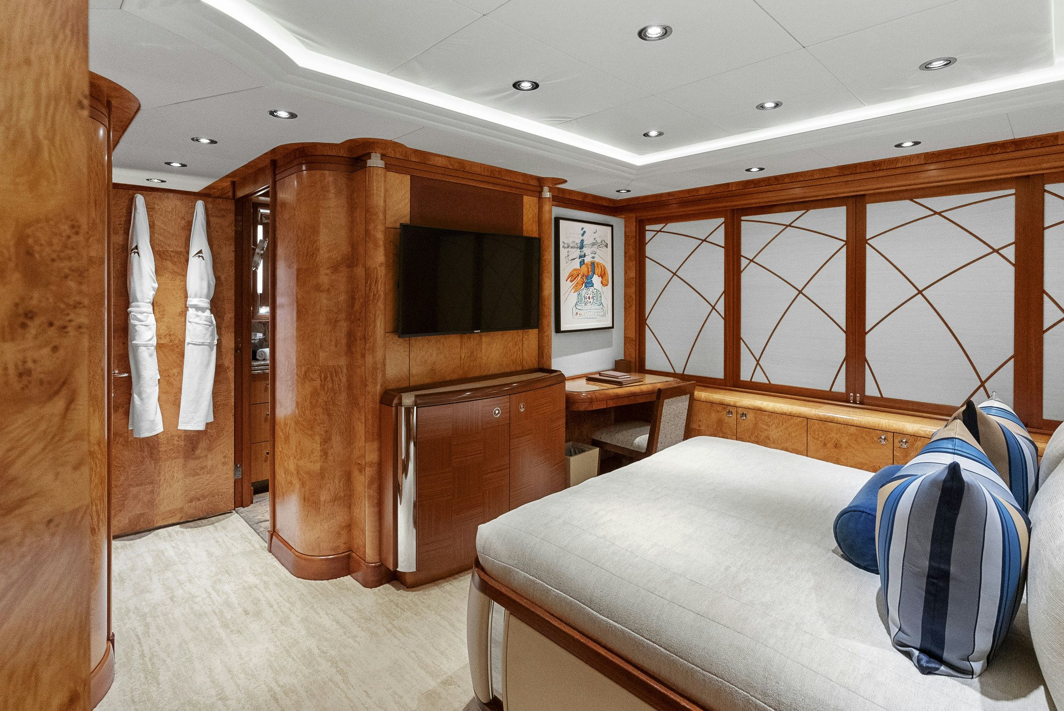 a room with a bed and a tv aboard AMICA MEA Yacht for Charter