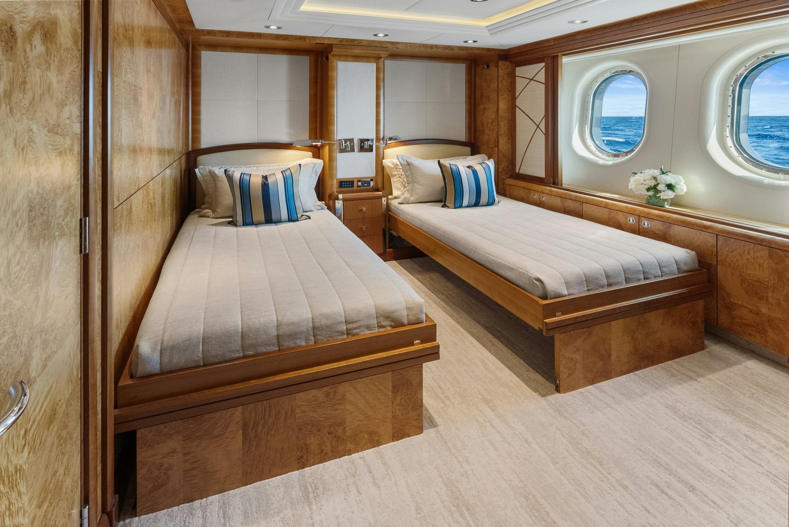 a room with two beds aboard AMICA MEA Yacht for Charter