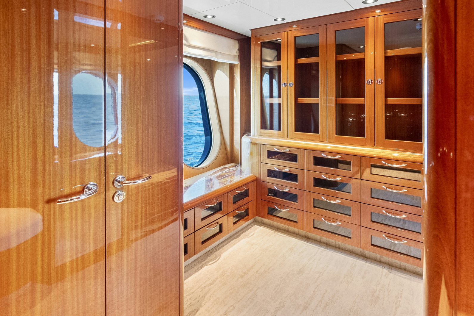 a room with wooden cabinets aboard AMICA MEA Yacht for Charter