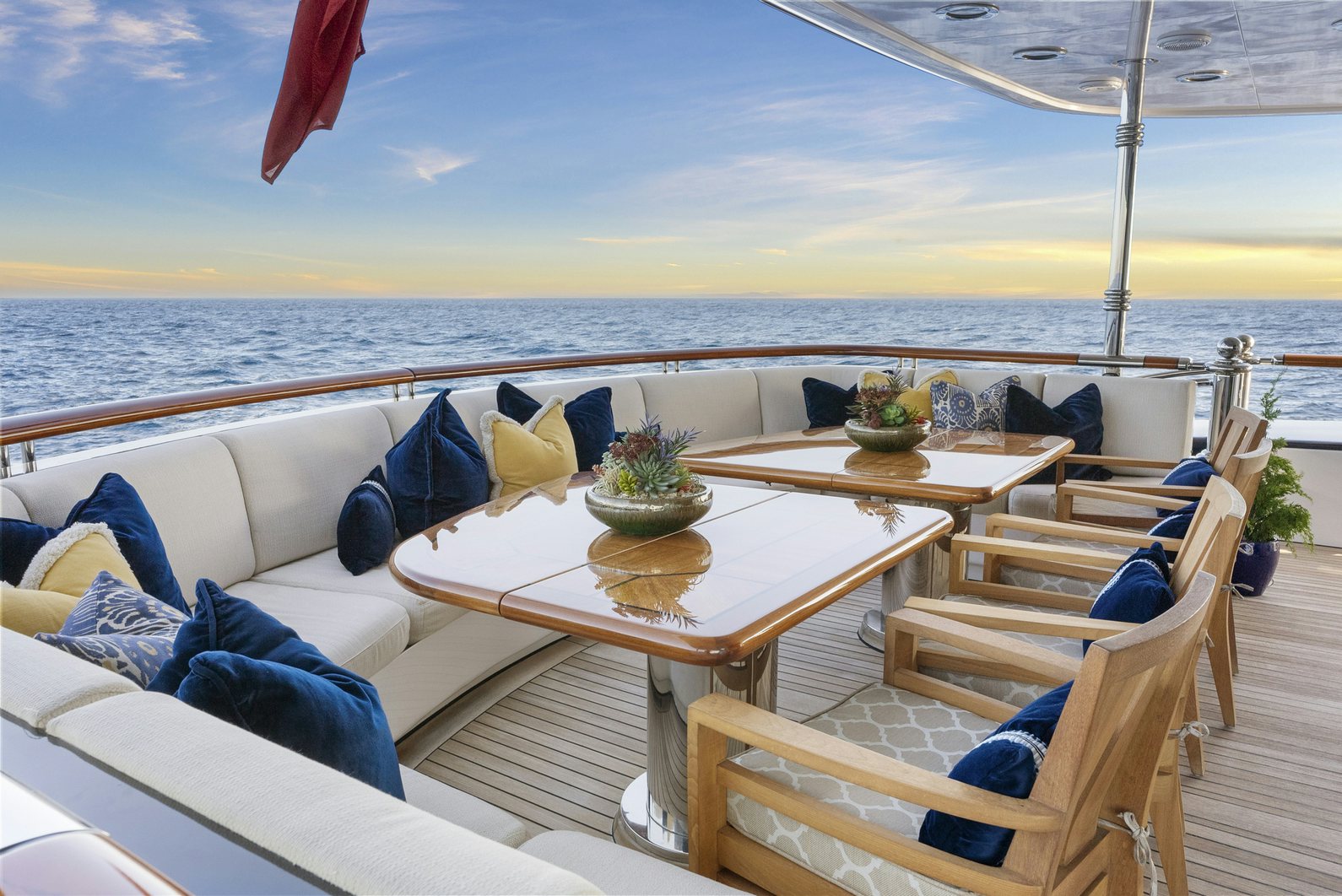 a patio with a table and chairs aboard AMICA MEA Yacht for Charter