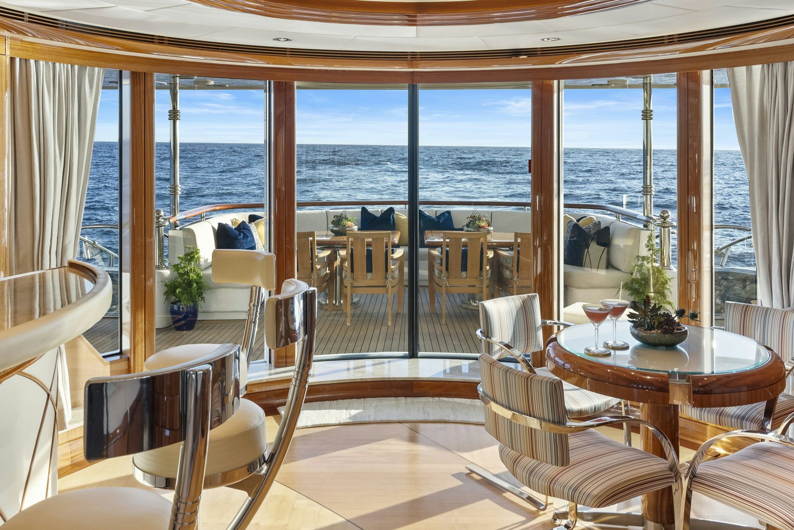 a room with a table and chairs aboard AMICA MEA Yacht for Charter