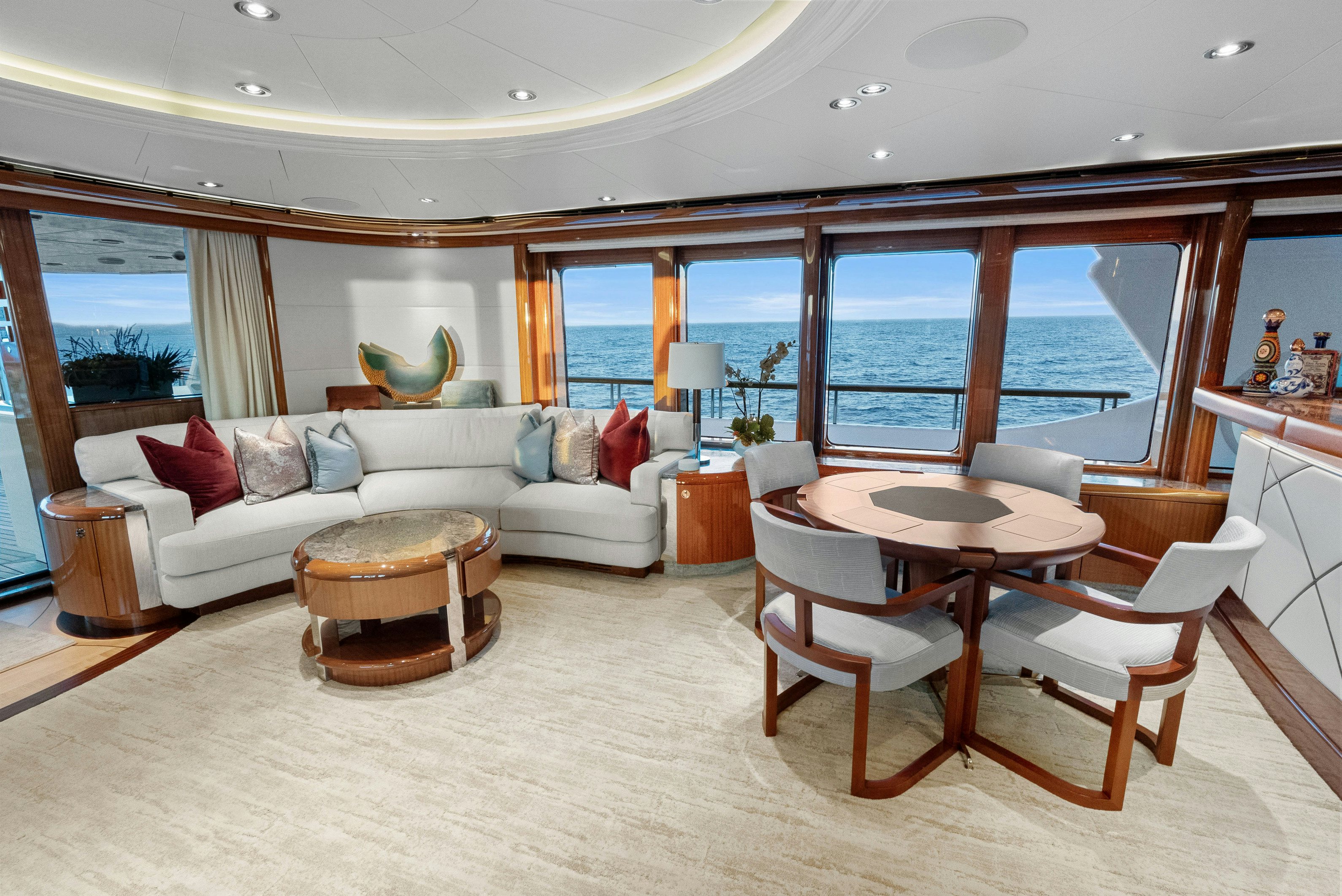 a living room with a couch and a table aboard AMICA MEA Yacht for Charter