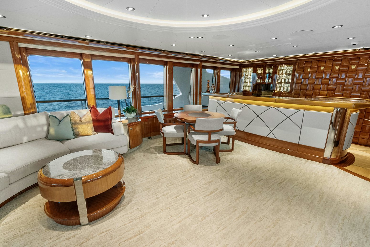 a living room with a couch and a table aboard AMICA MEA Yacht for Charter