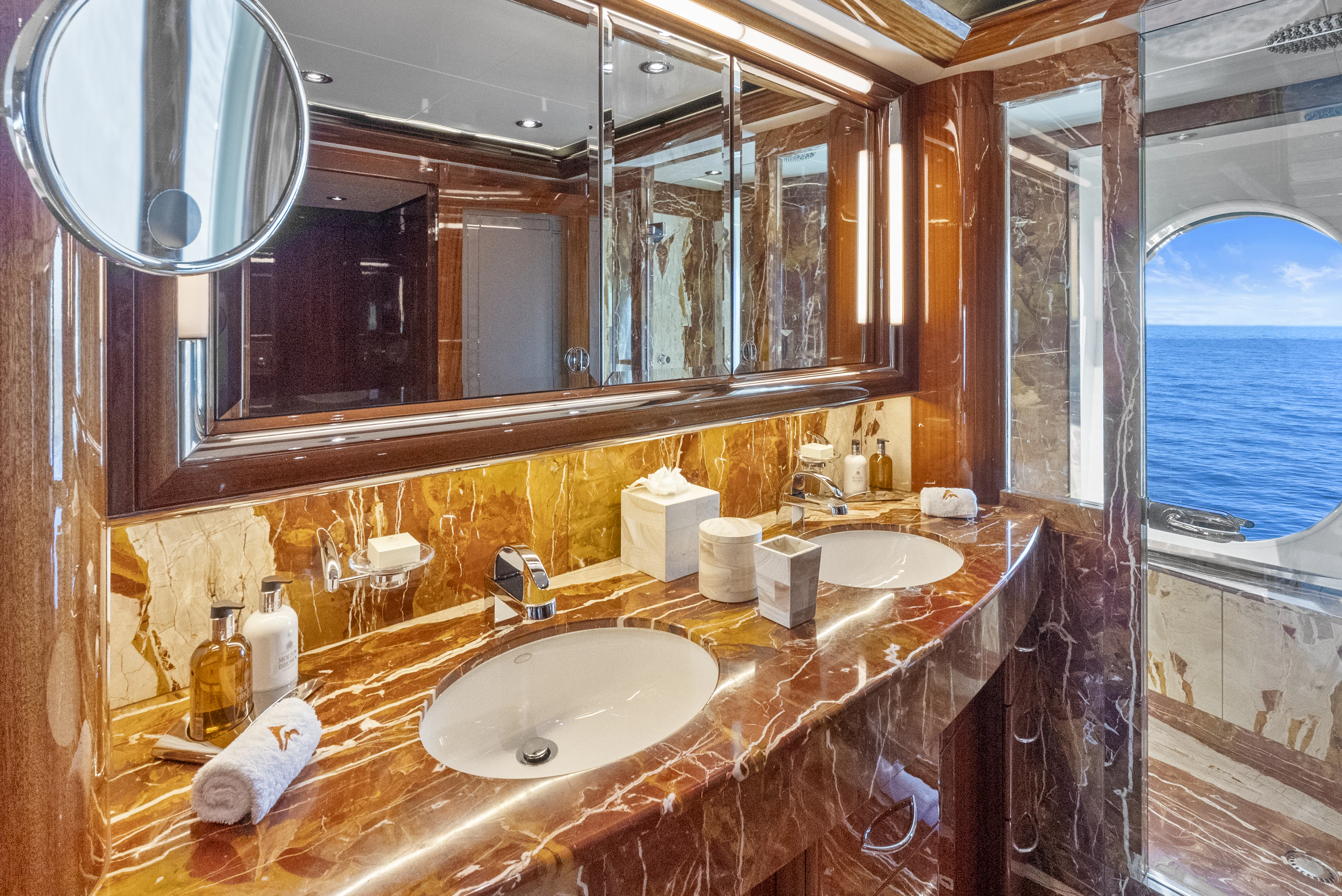 a bathroom with two sinks aboard AMICA MEA Yacht for Sale