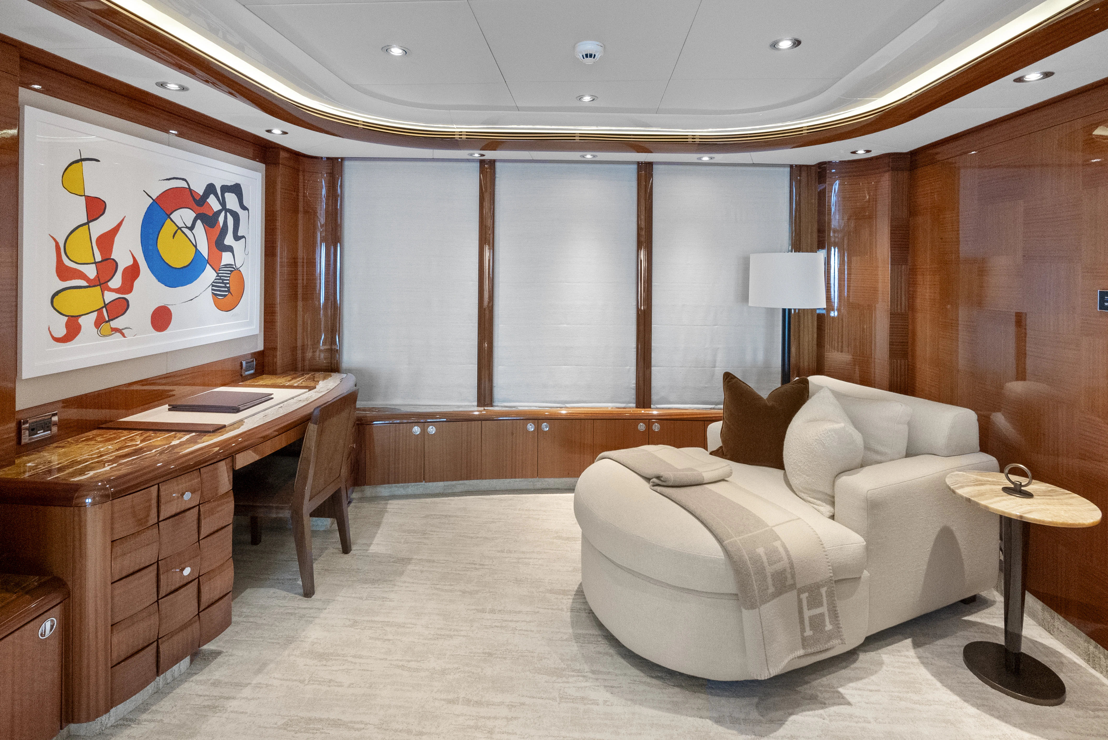 a room with a couch and a desk aboard AMICA MEA Yacht for Sale