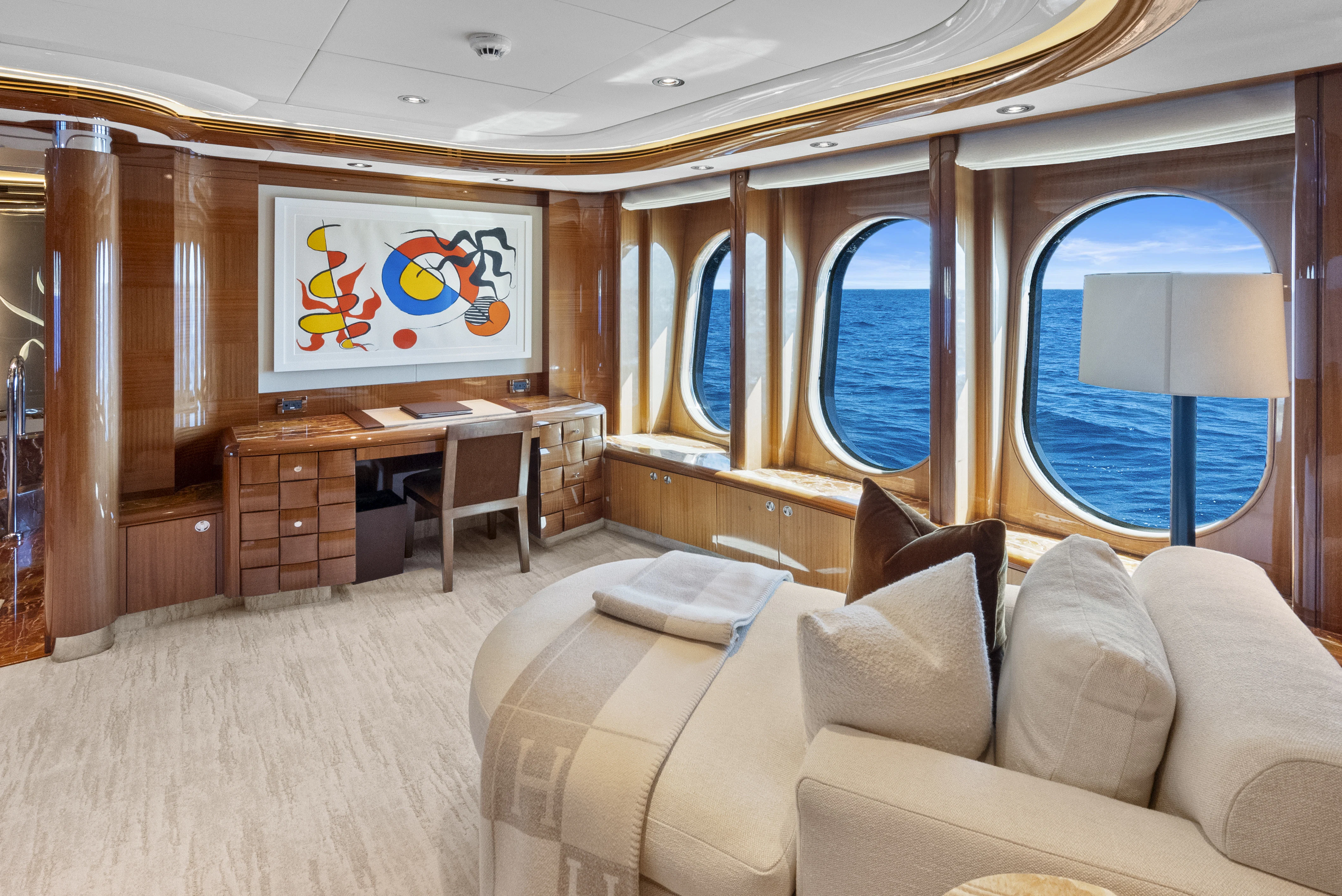 a room with a couch and a desk aboard AMICA MEA Yacht for Sale