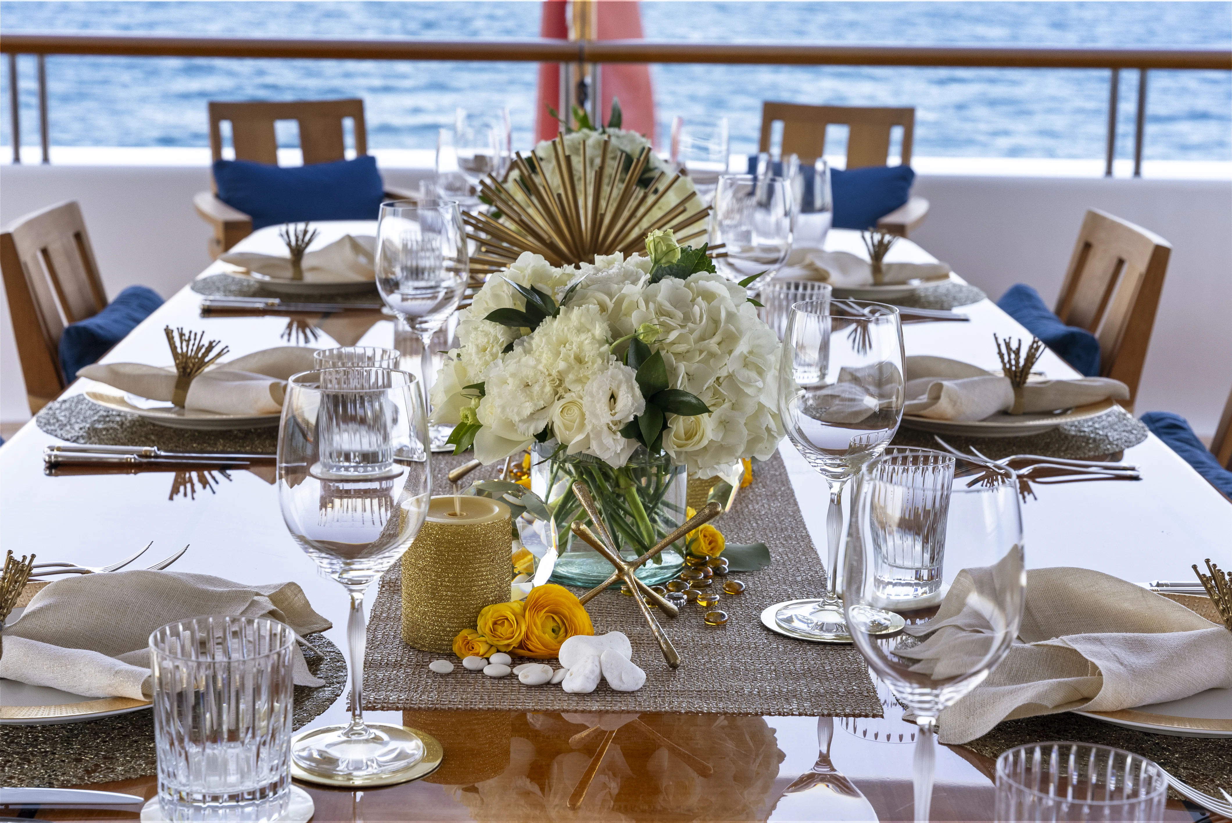 a table set with place settings aboard AMICA MEA Yacht for Sale