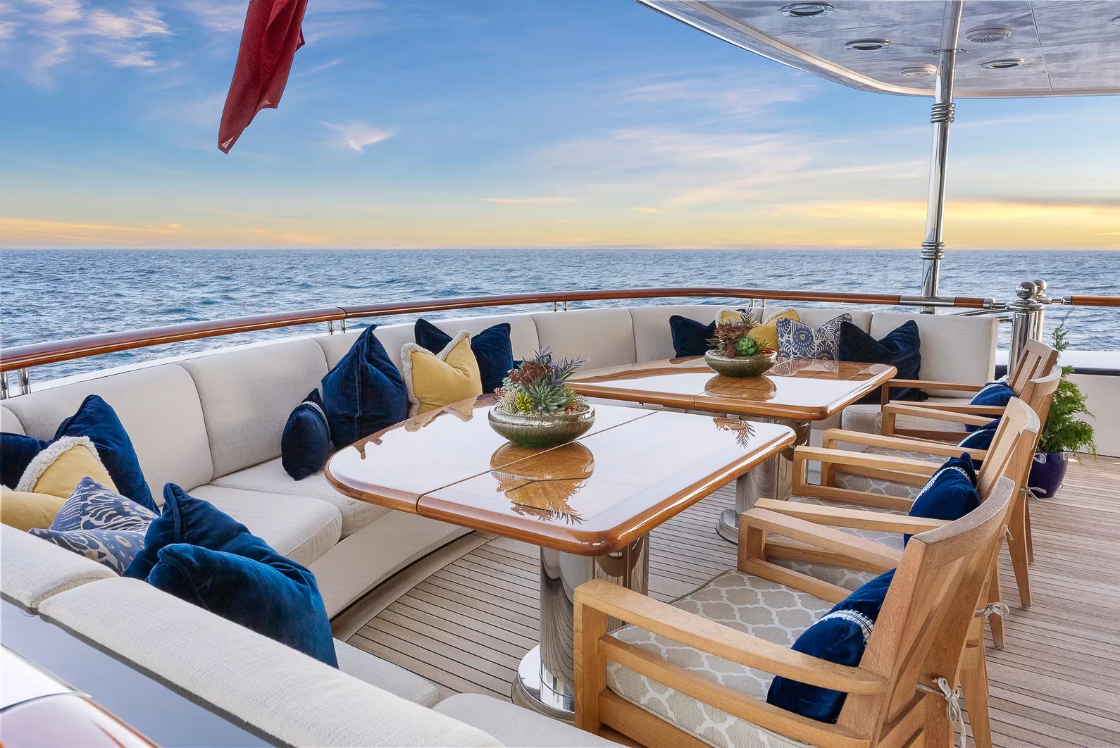 a patio with a table and chairs aboard AMICA MEA Yacht for Sale