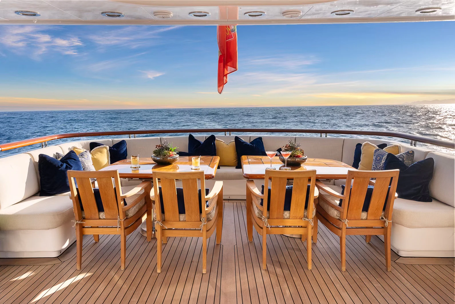 a deck with chairs and tables aboard AMICA MEA Yacht for Sale