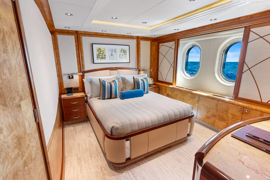 a room with a couch and a window aboard AMICA MEA Yacht for Sale
