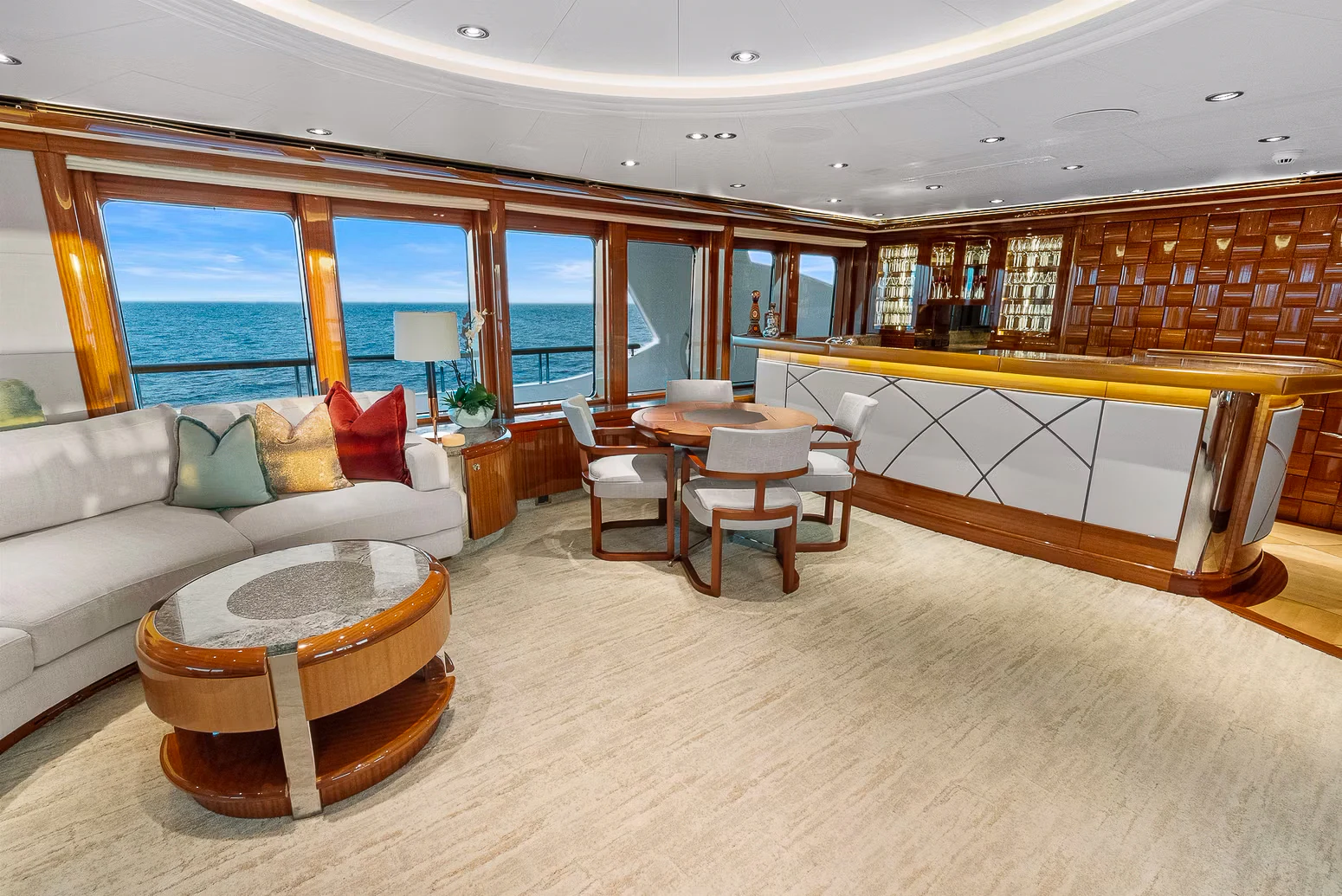 a living room with a couch and a table aboard AMICA MEA Yacht for Sale