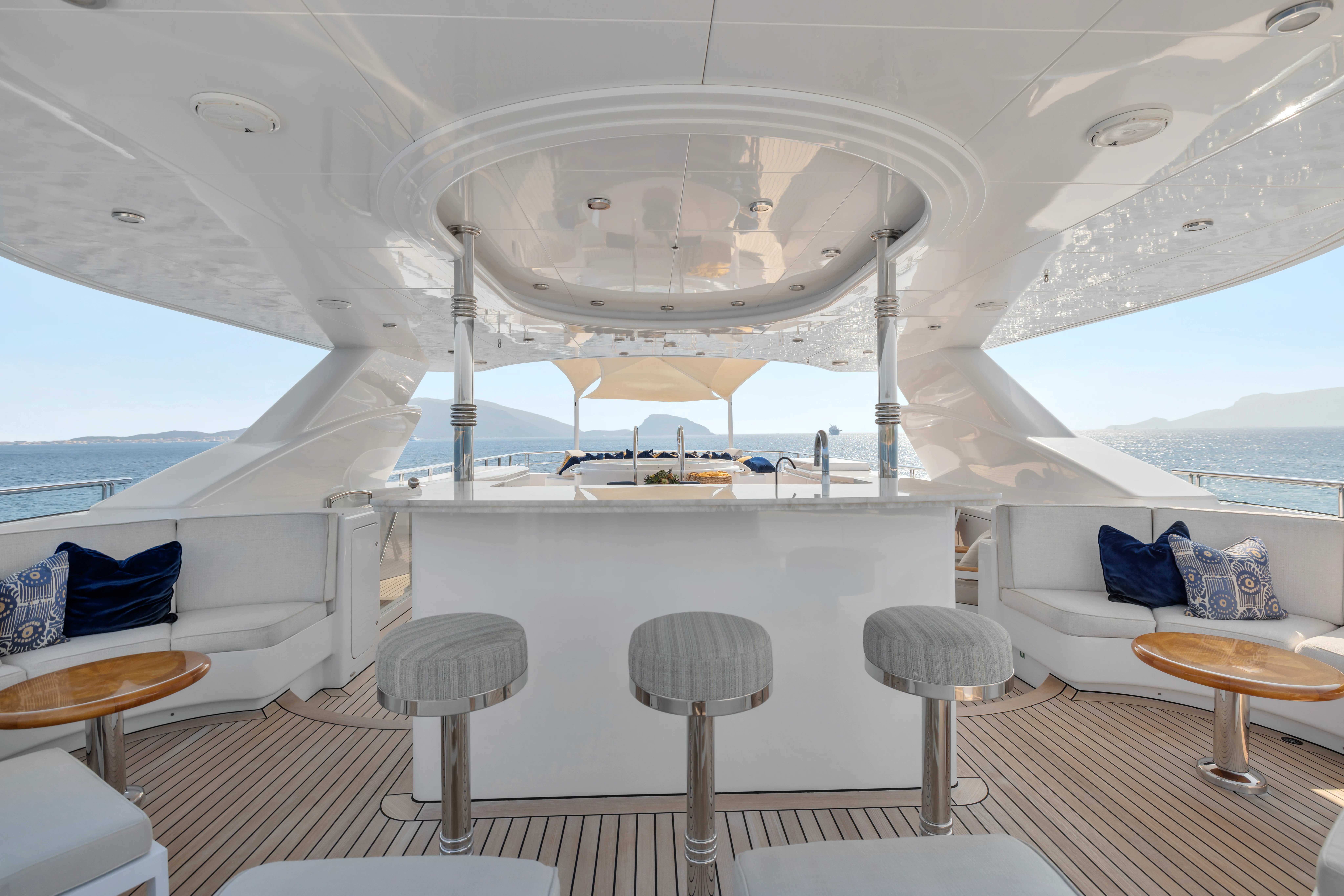 a large white tent with stools and tables aboard AMICA MEA Yacht for Sale